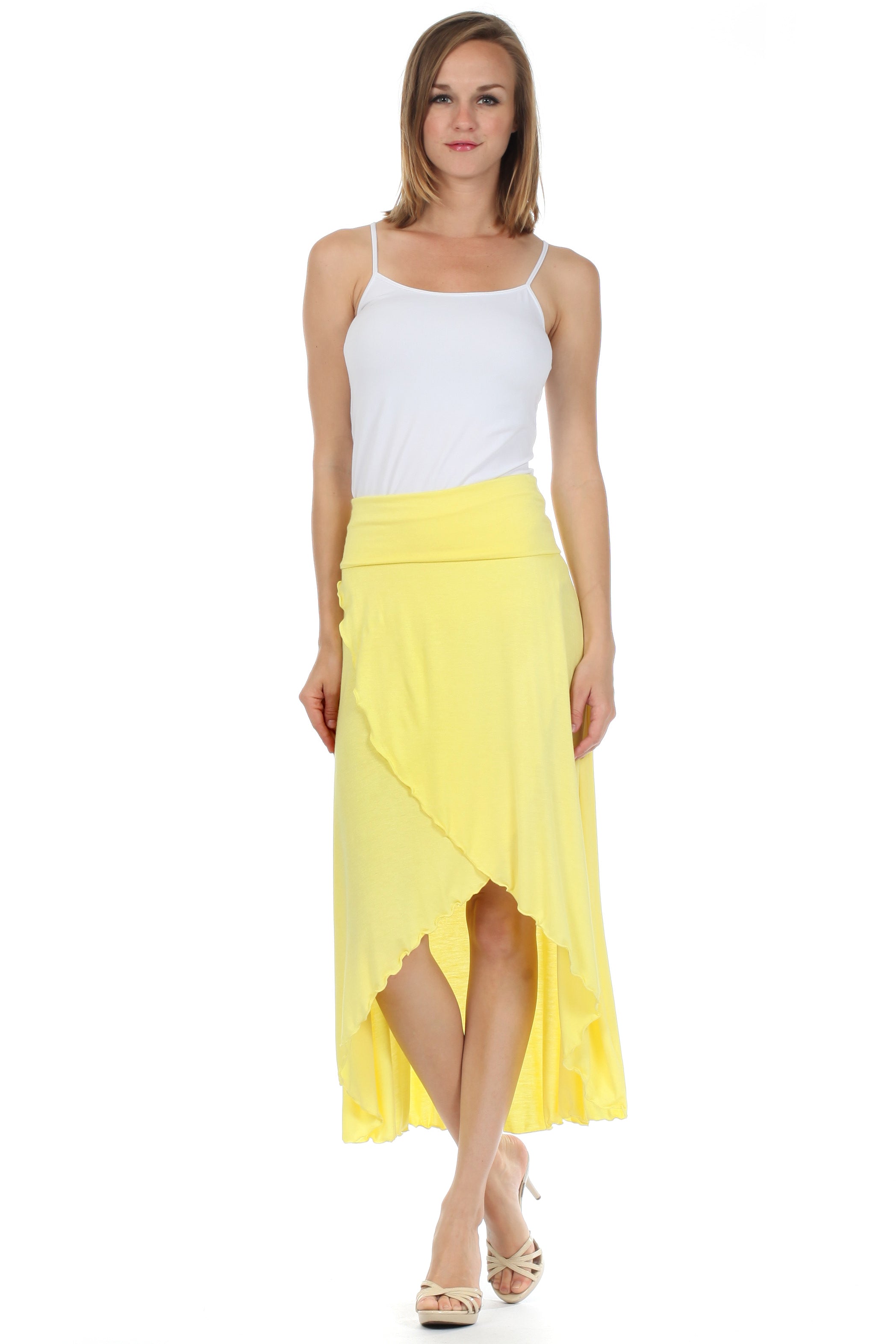 Woman wearing a white top and yellow skirt on a white background
