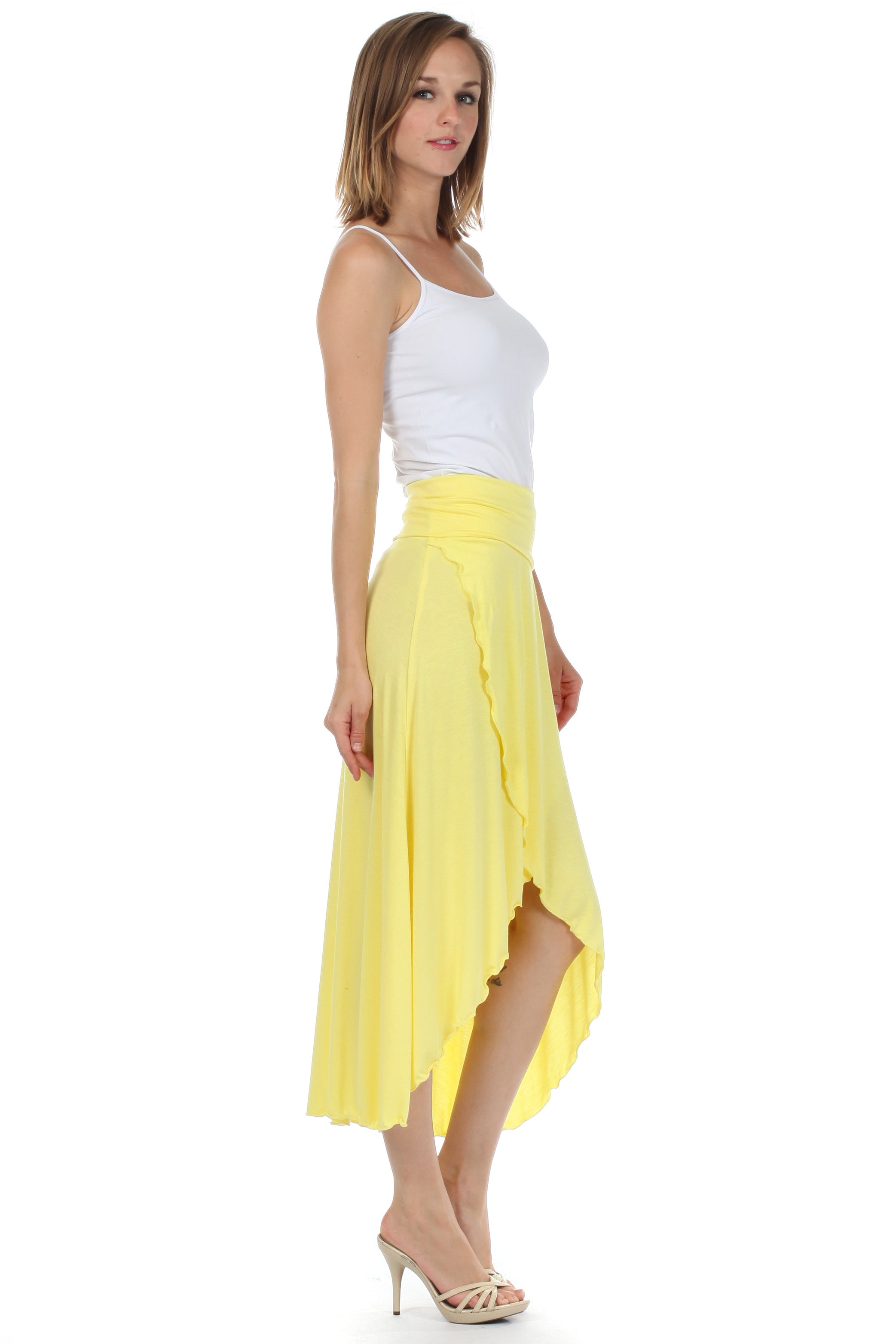 Woman wearing a white top and yellow skirt on a white background