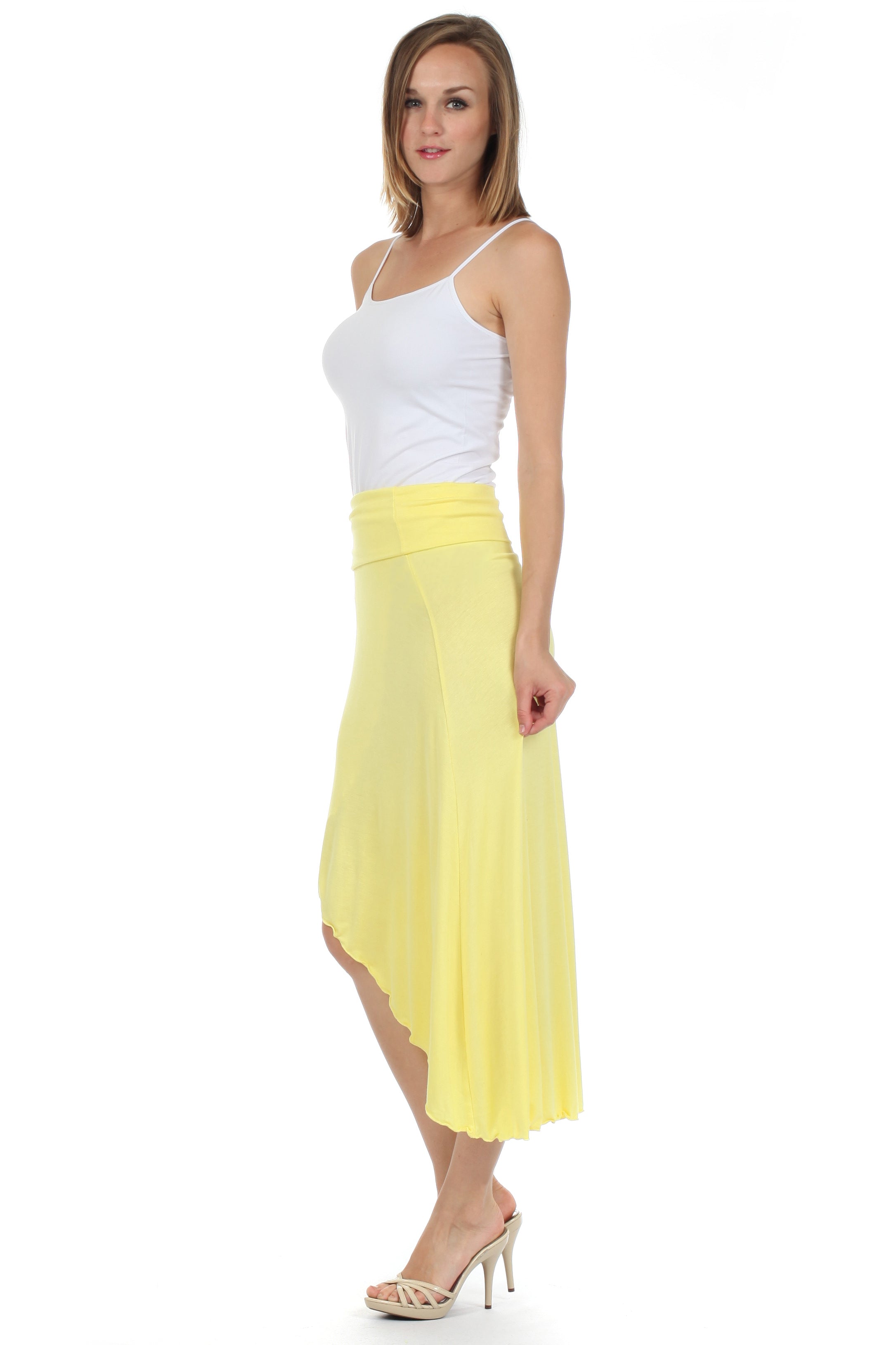 Woman wearing a white top and yellow skirt on a white background