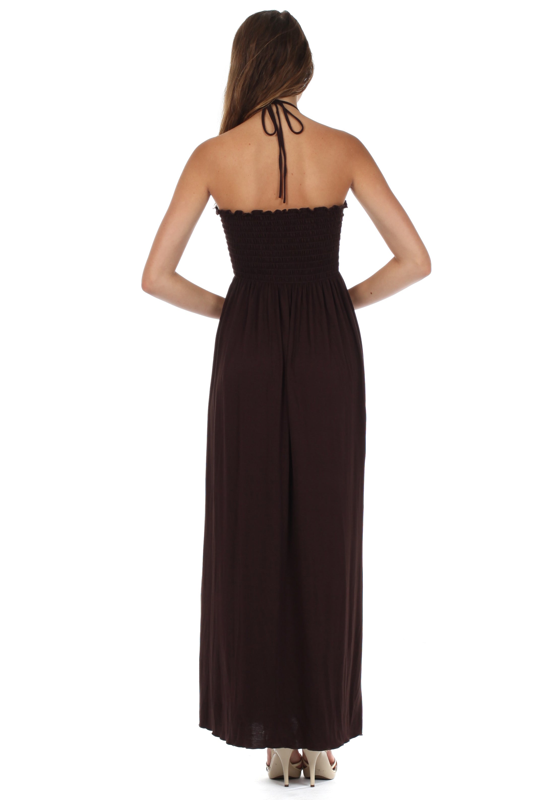 Woman wearing a strapless brown dress on a white background