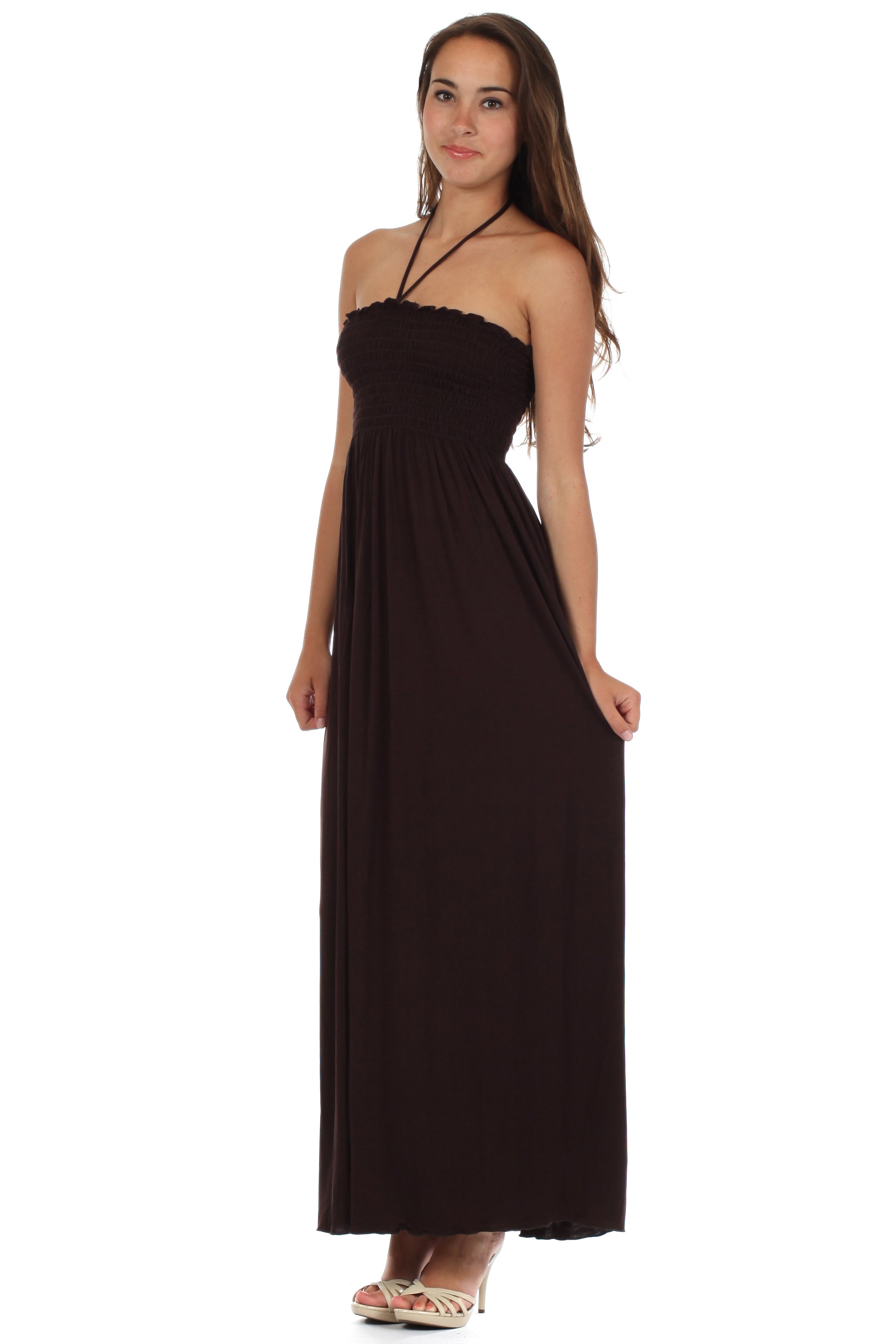 Woman wearing a black halter neck dress on a white background