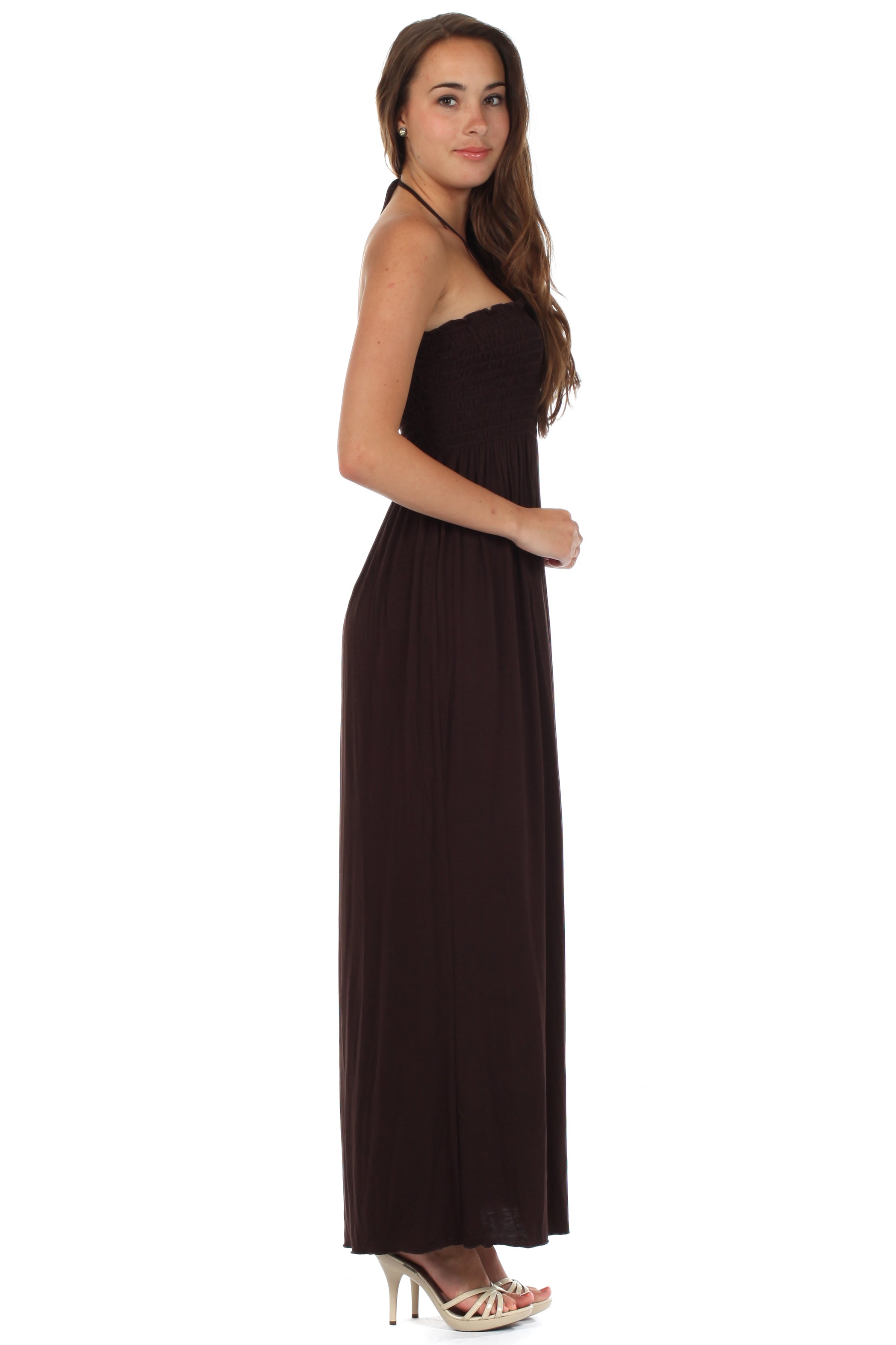Woman wearing a black strapless dress on a white background