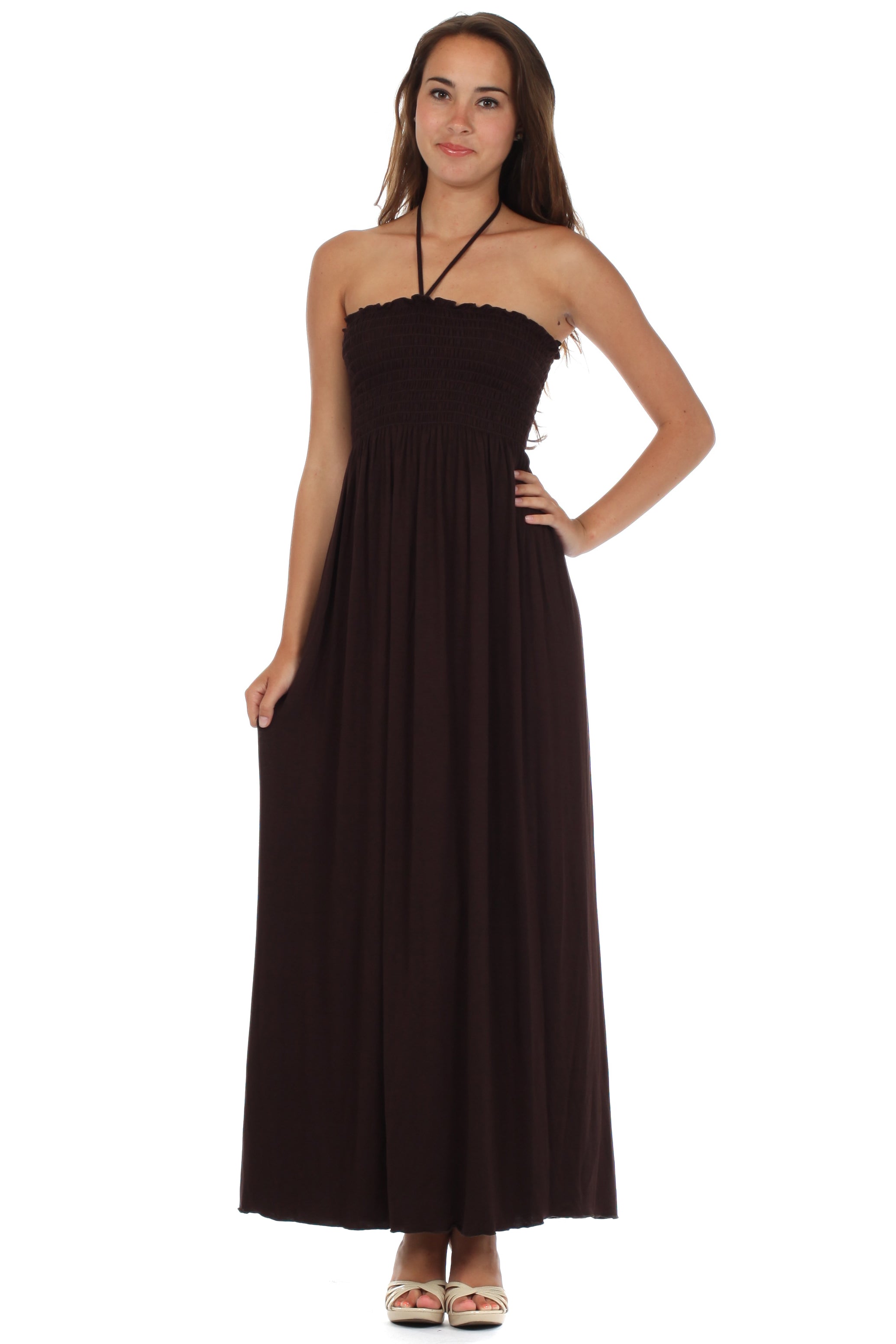 Woman wearing a black halter neck dress on a white background