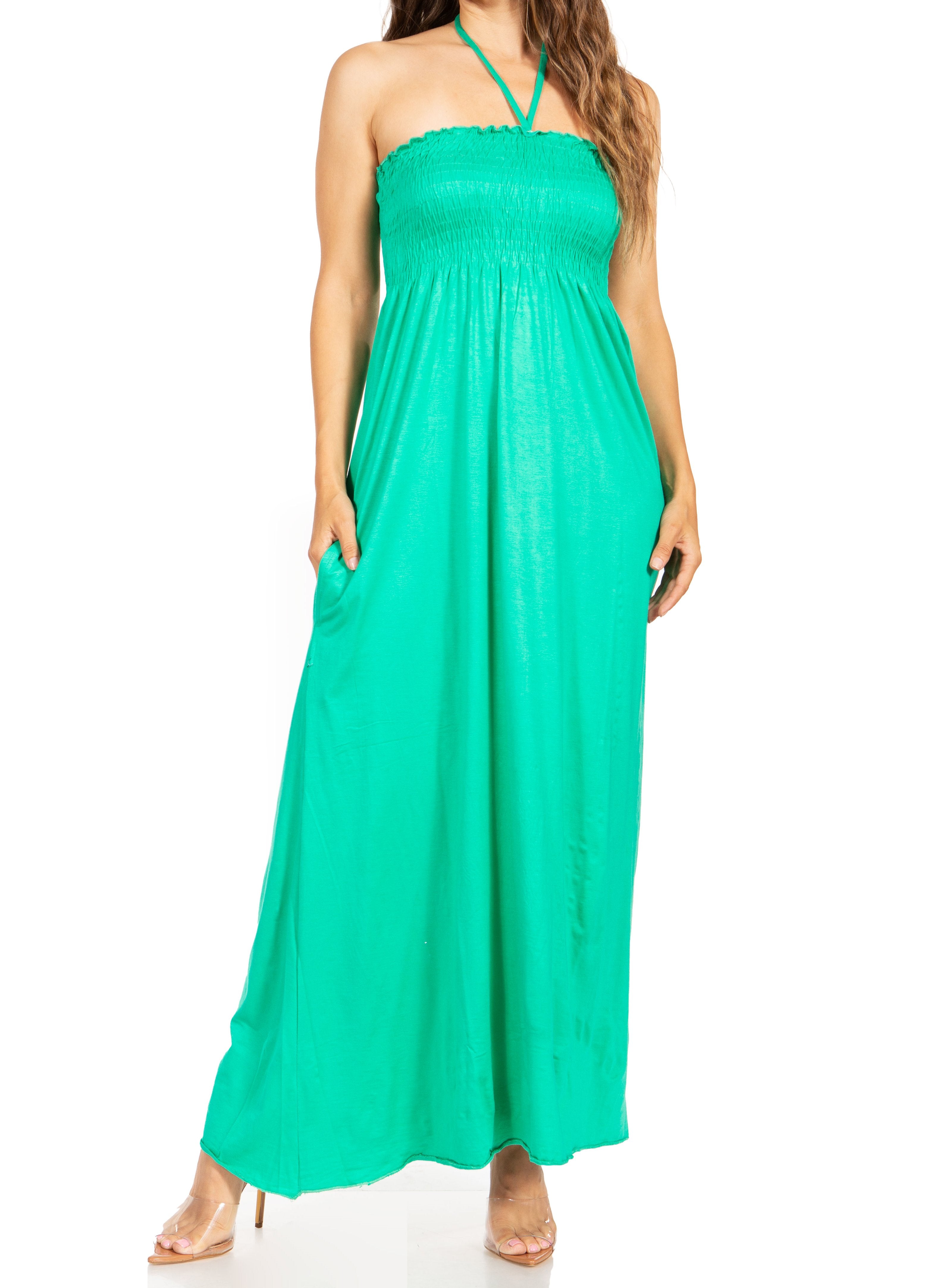 Green halter neck dress on a white background