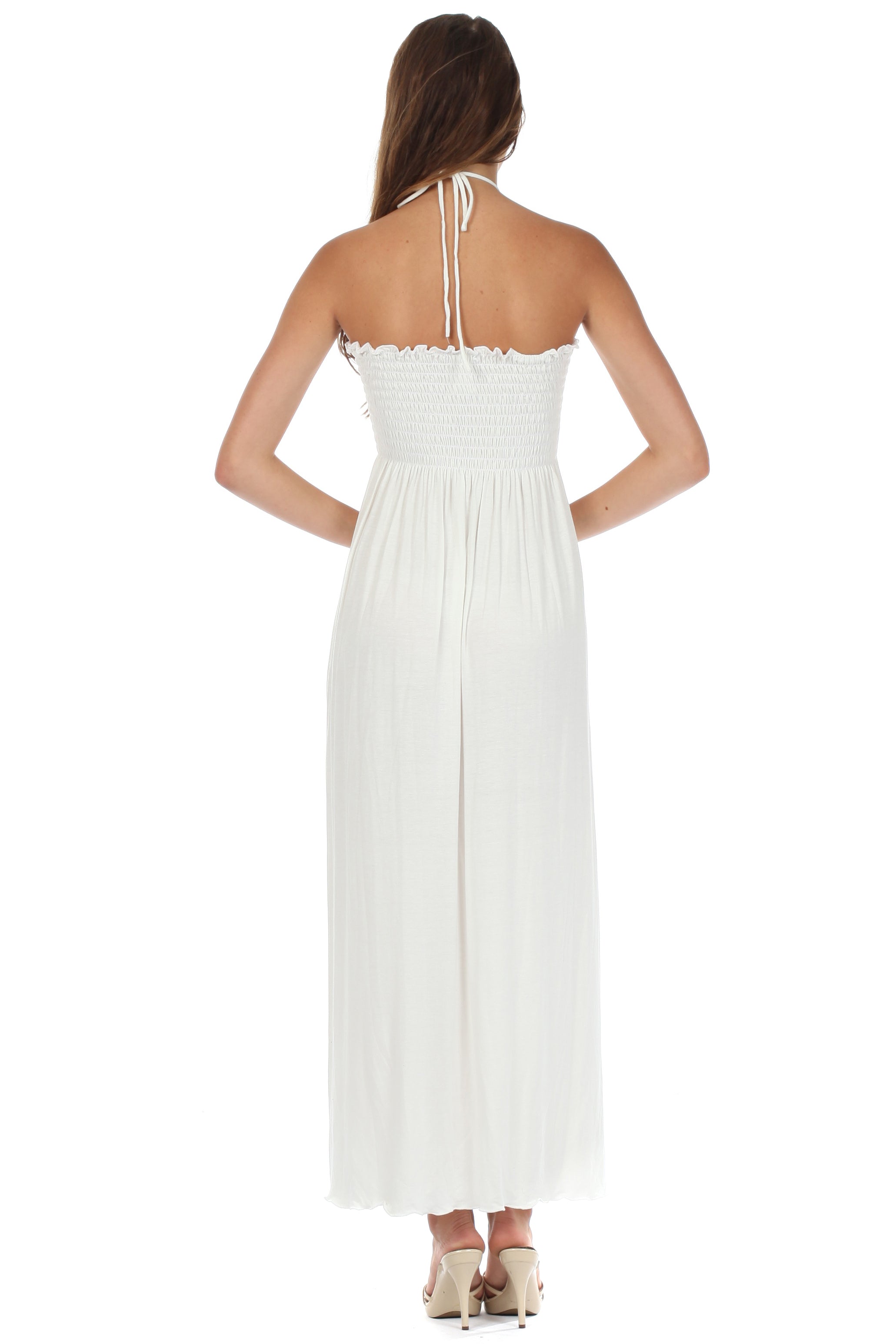 White halter neck dress worn by a model on a white background