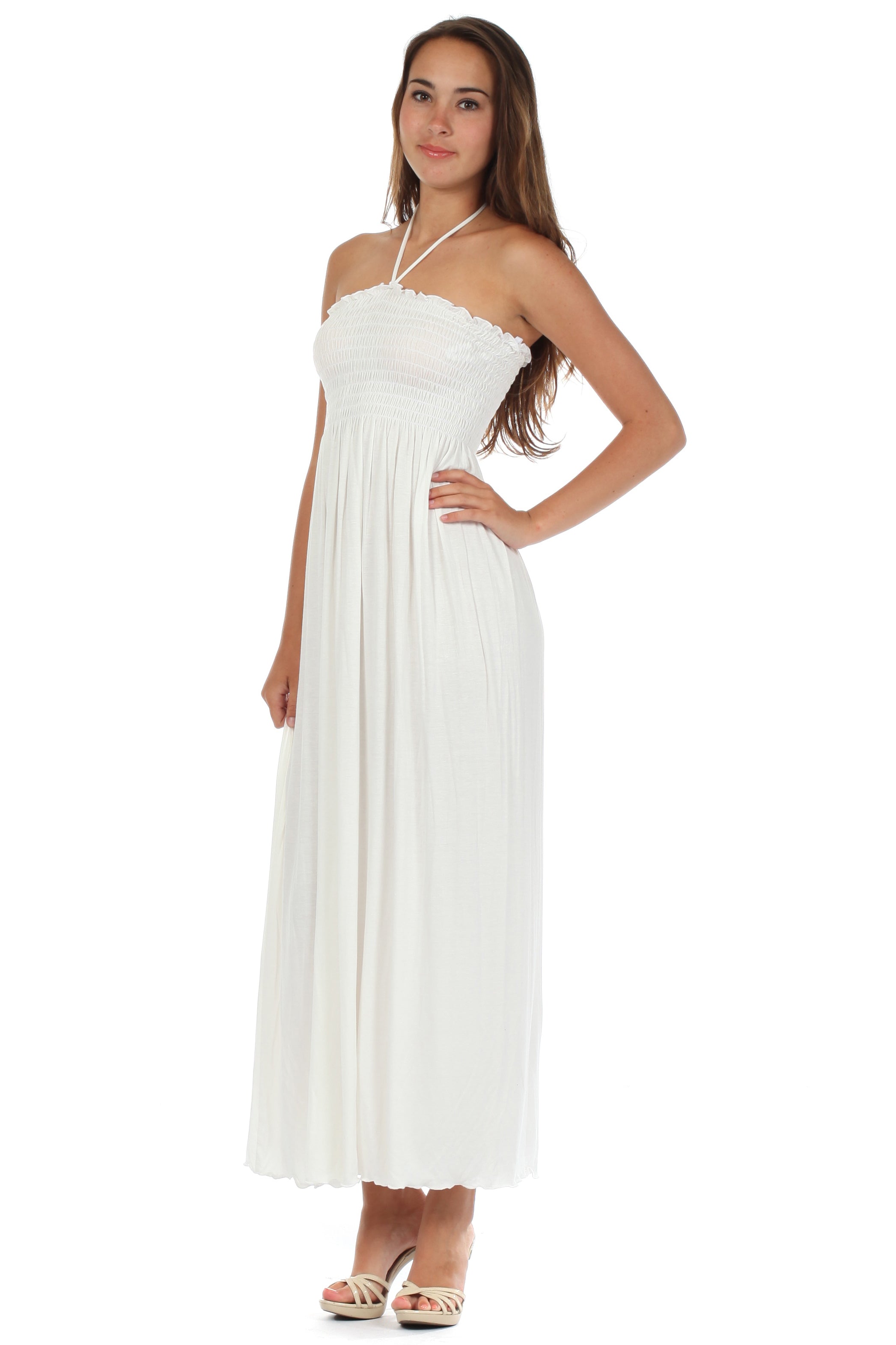 Woman wearing a white strapless dress on a white background