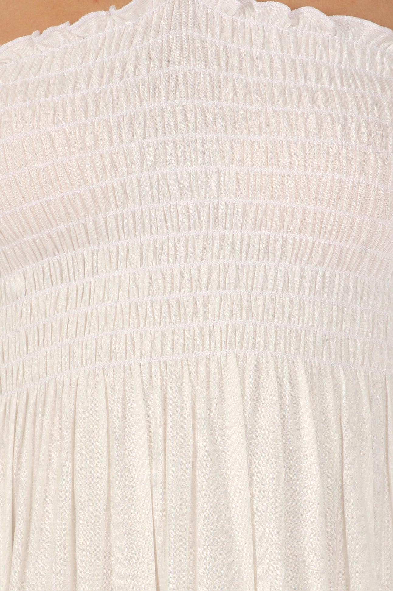 Close-up of a textured white fabric with a subtle pattern.