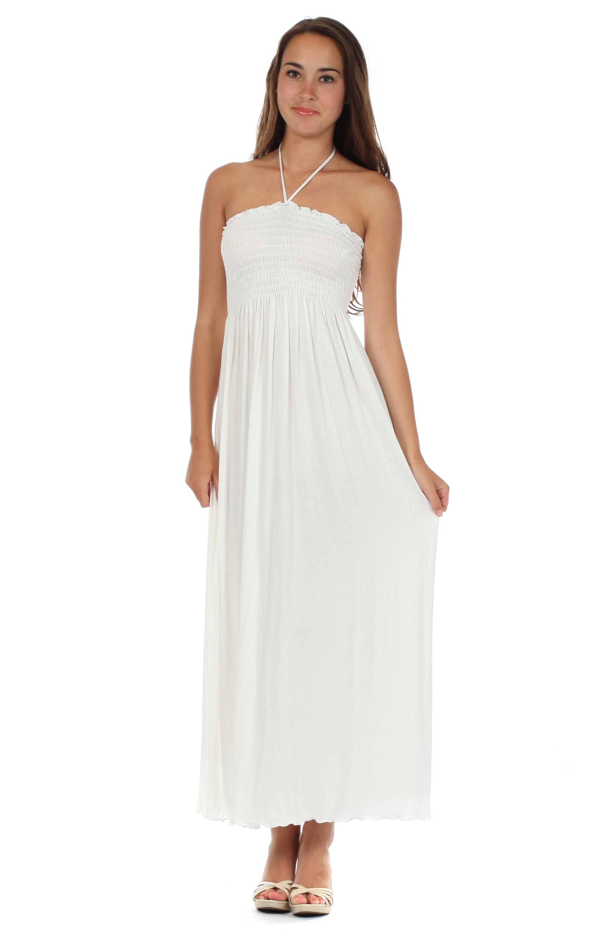 Woman wearing a white halter neck dress on a white background