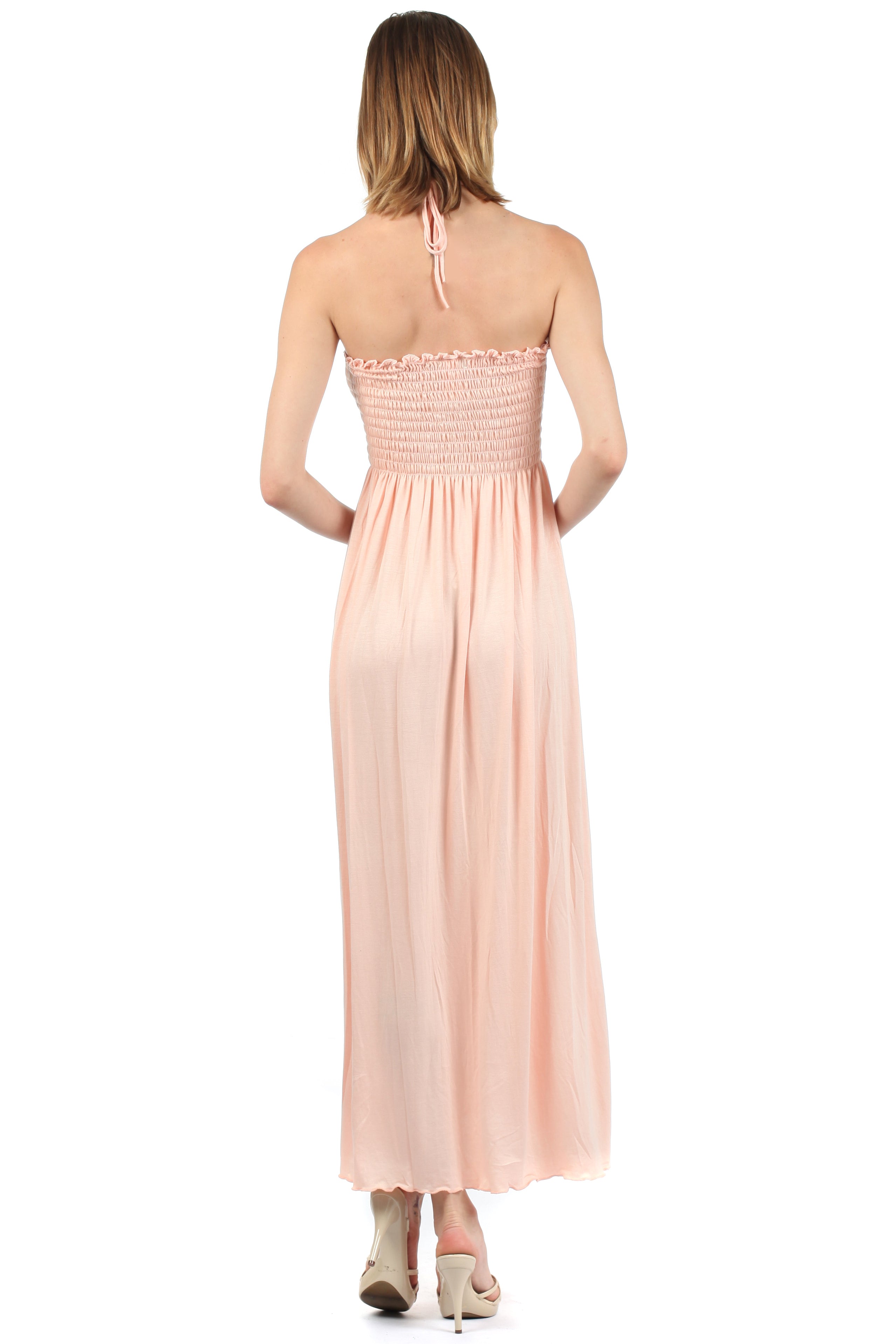 Woman wearing a pink strapless dress on a white background