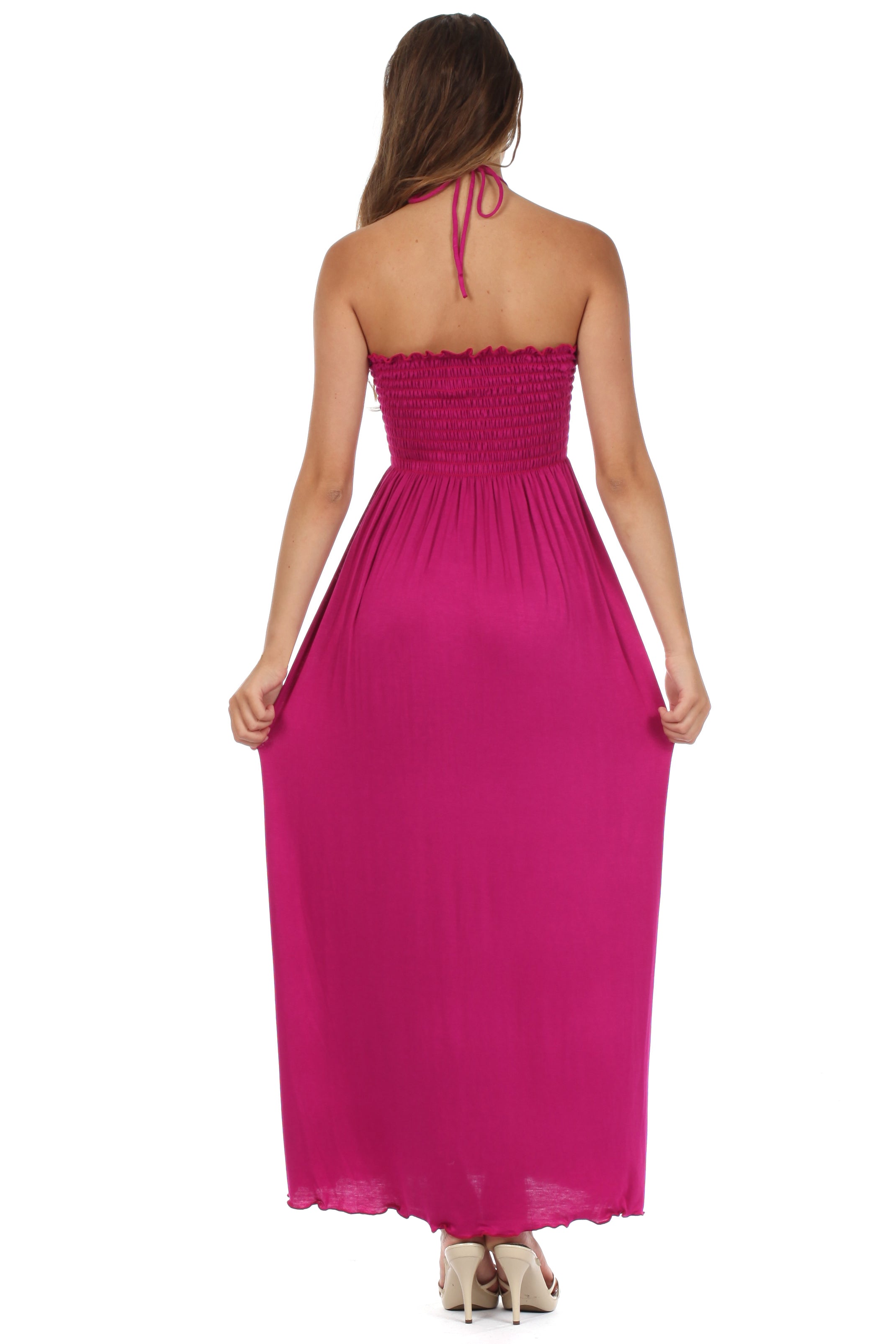 Woman wearing a pink strapless gown on a white background