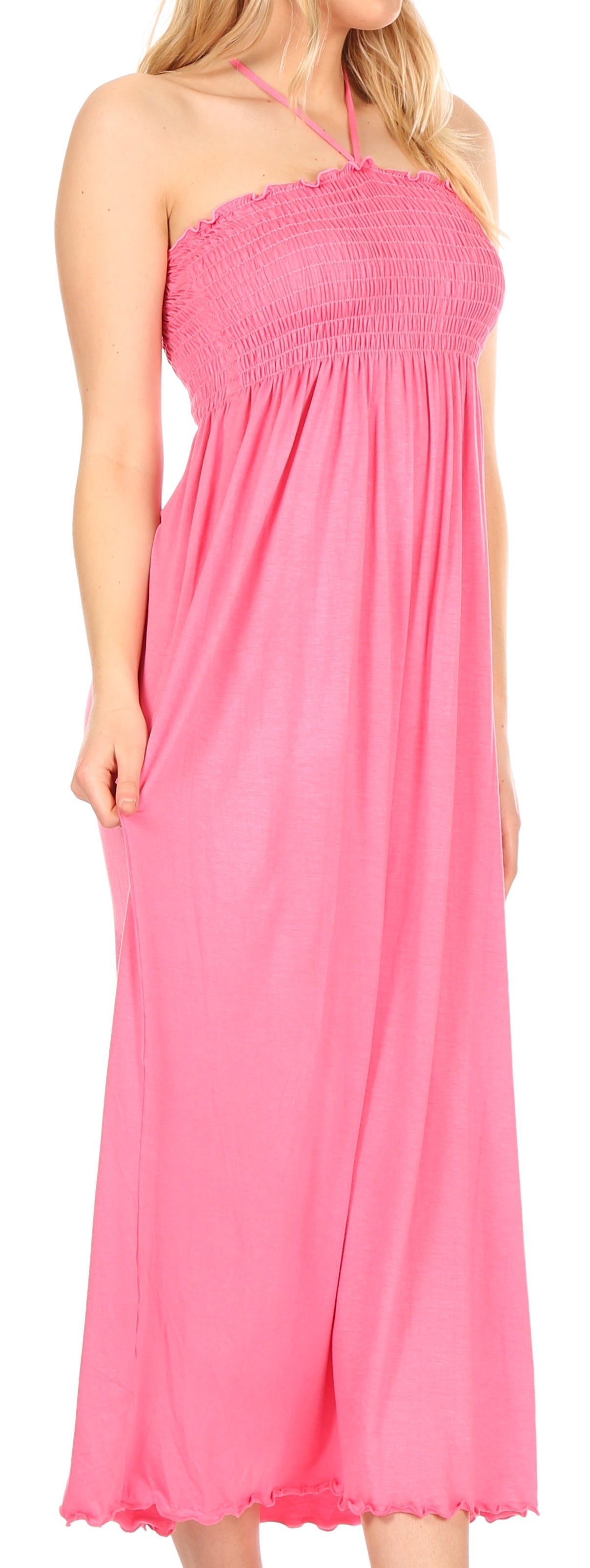 Pink halter neck dress on a white background