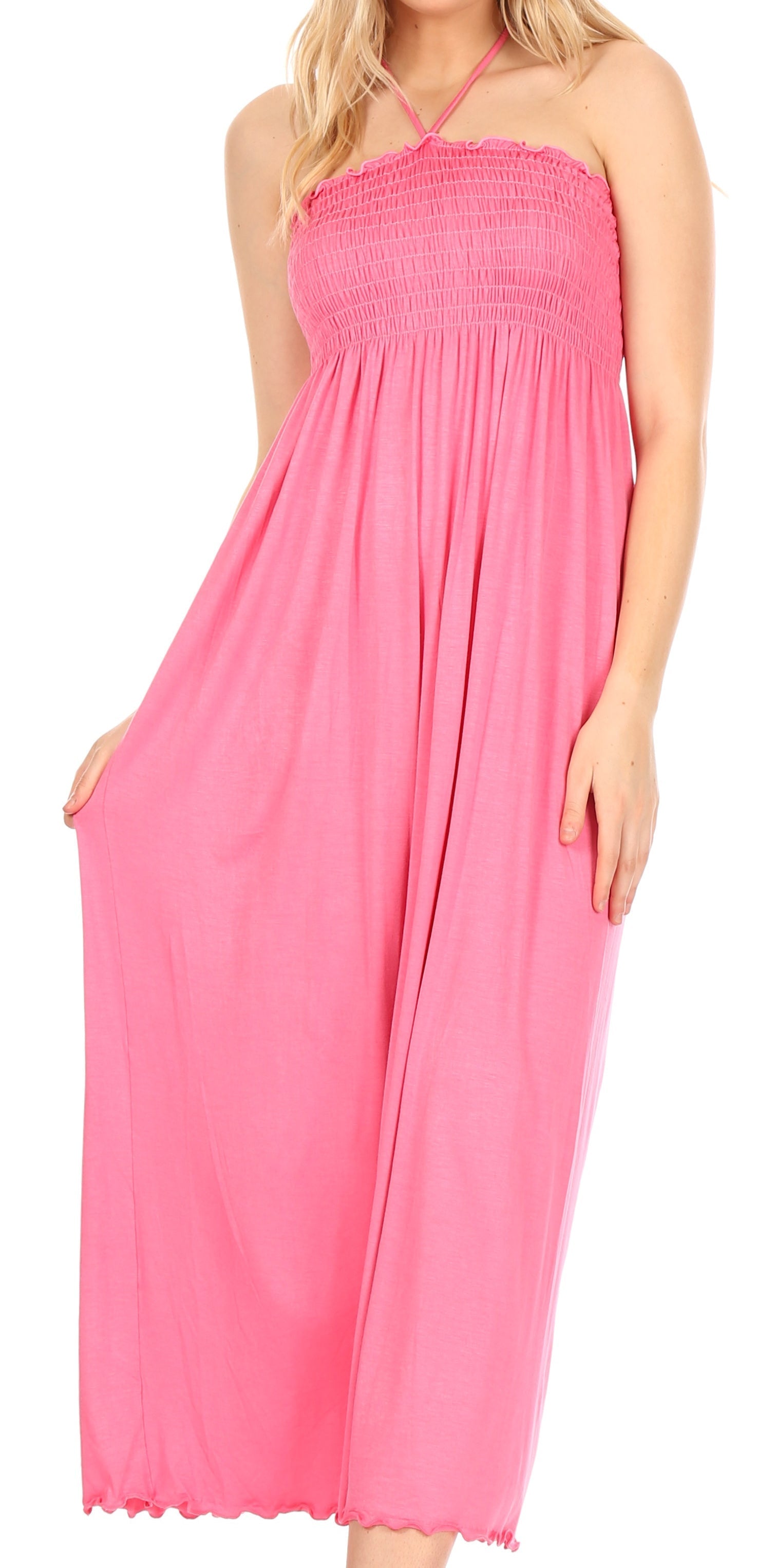 Pink halter neck dress worn by a model on a white background