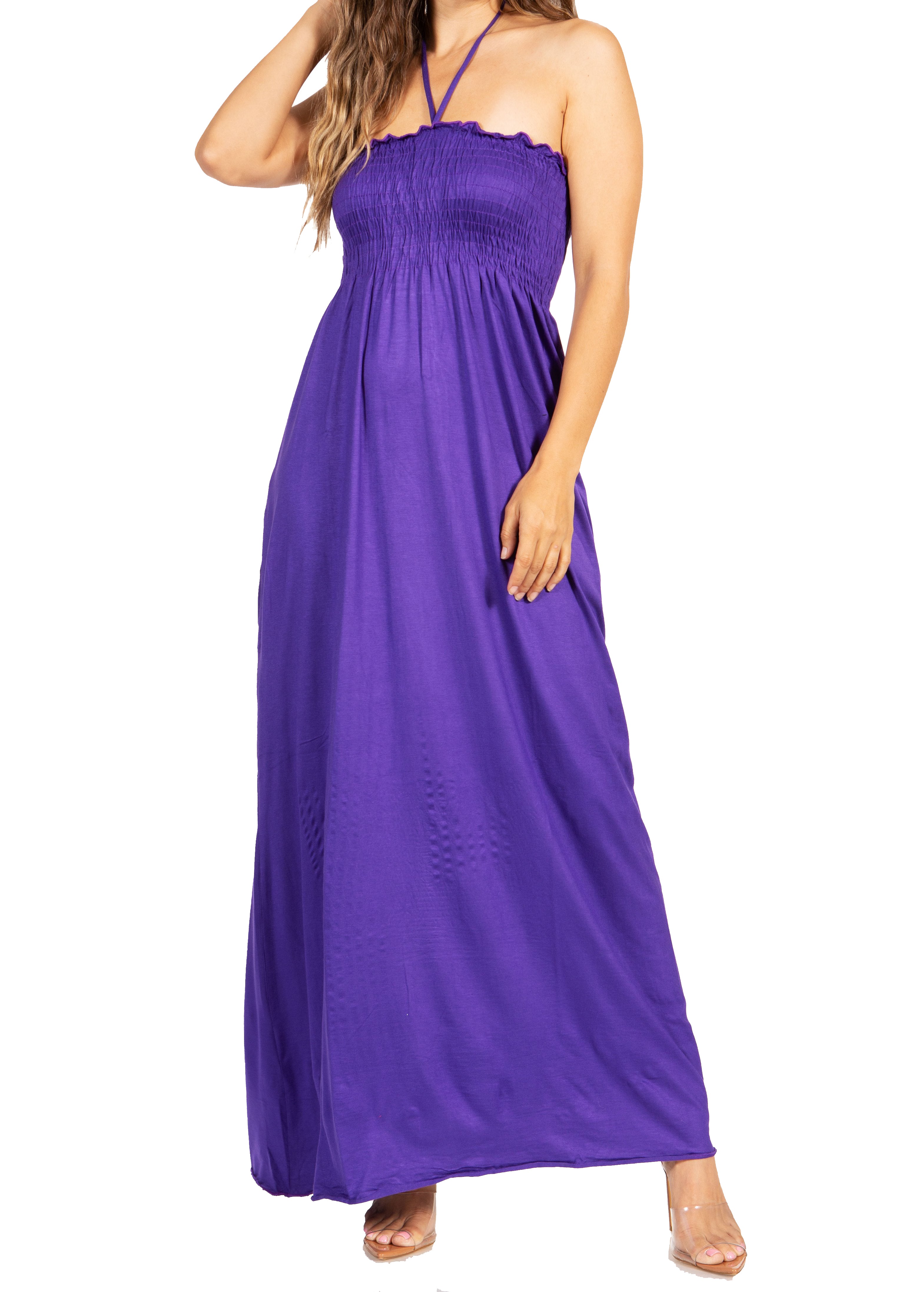 Woman wearing a purple halter neck maxi dress on a white background
