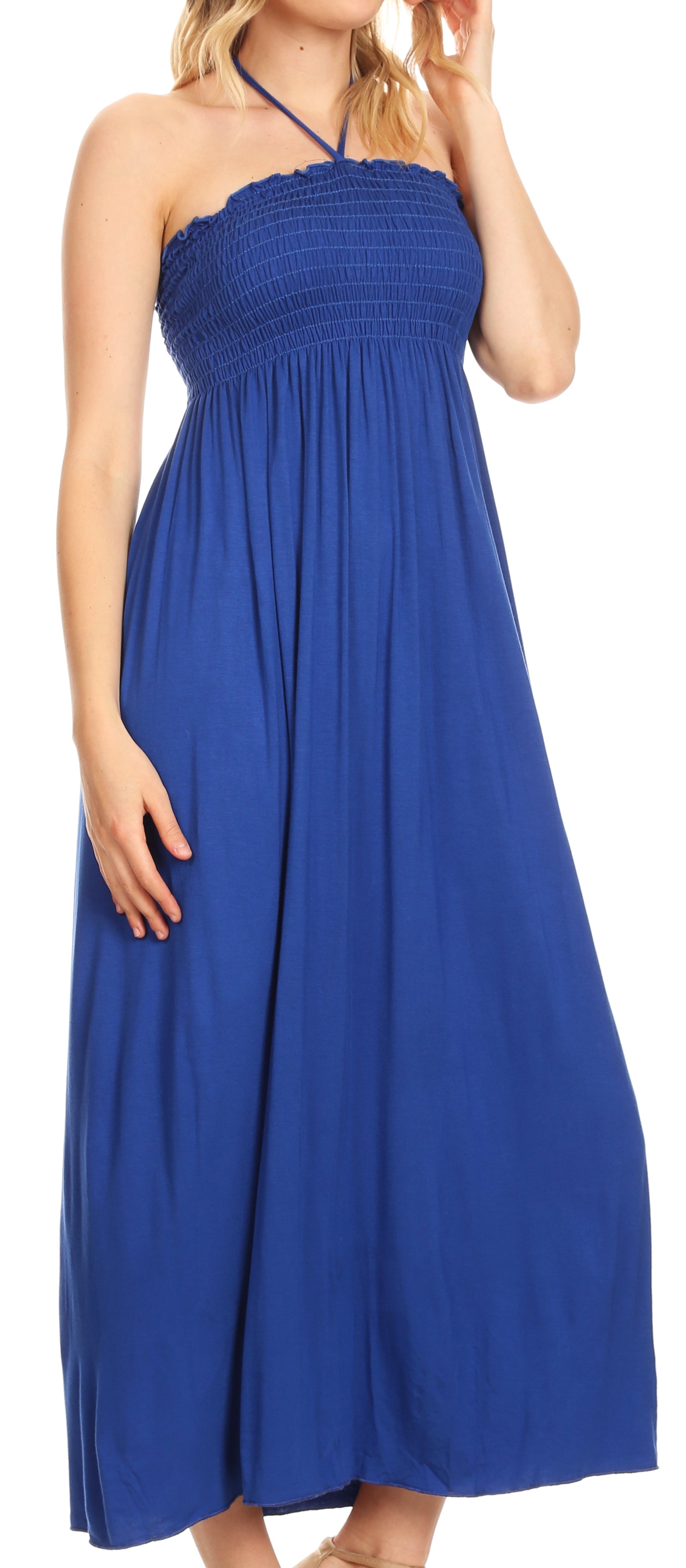 Woman wearing a blue halter neck maxi dress.