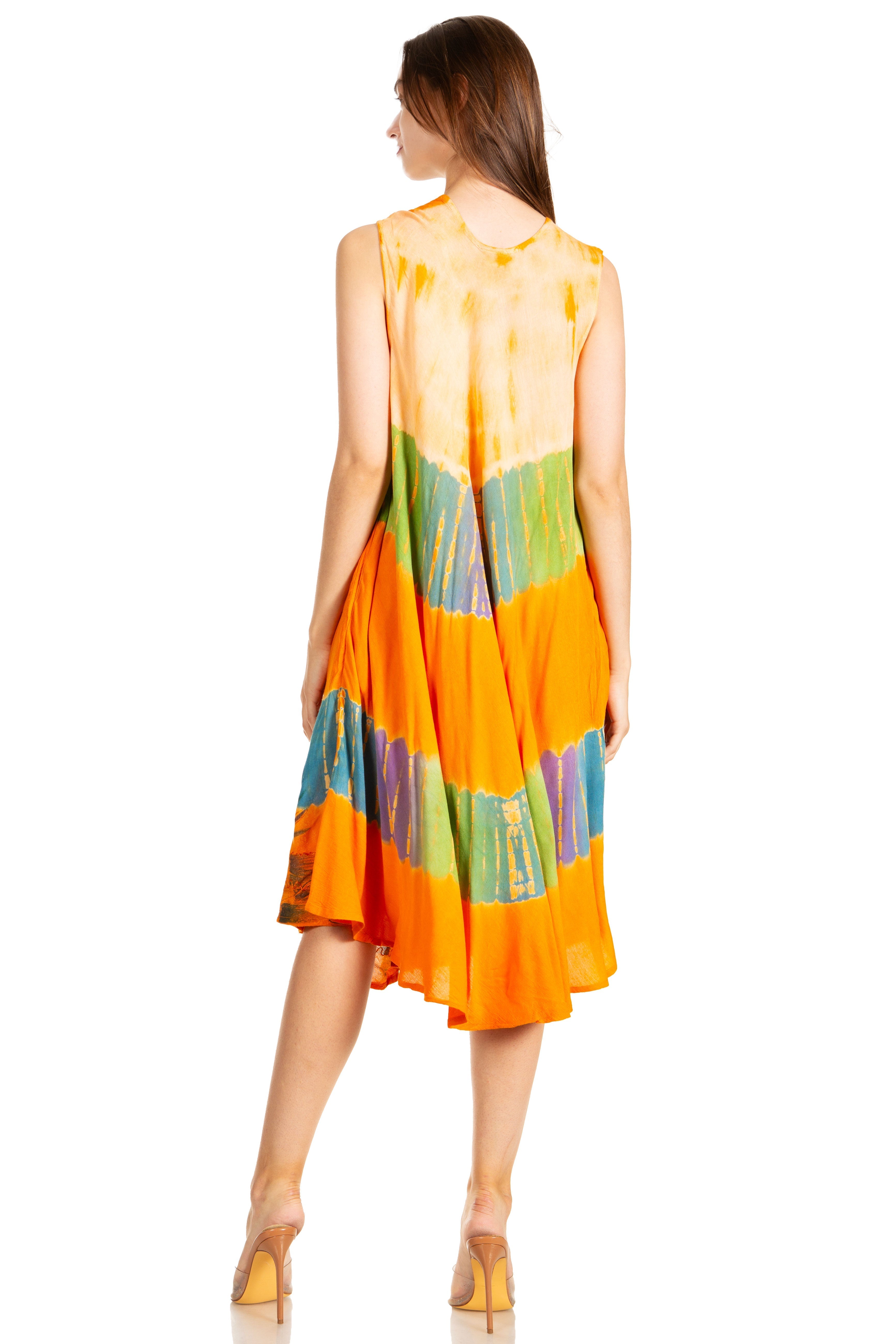 Woman wearing a colorful dress with a tie-dye pattern on a white background