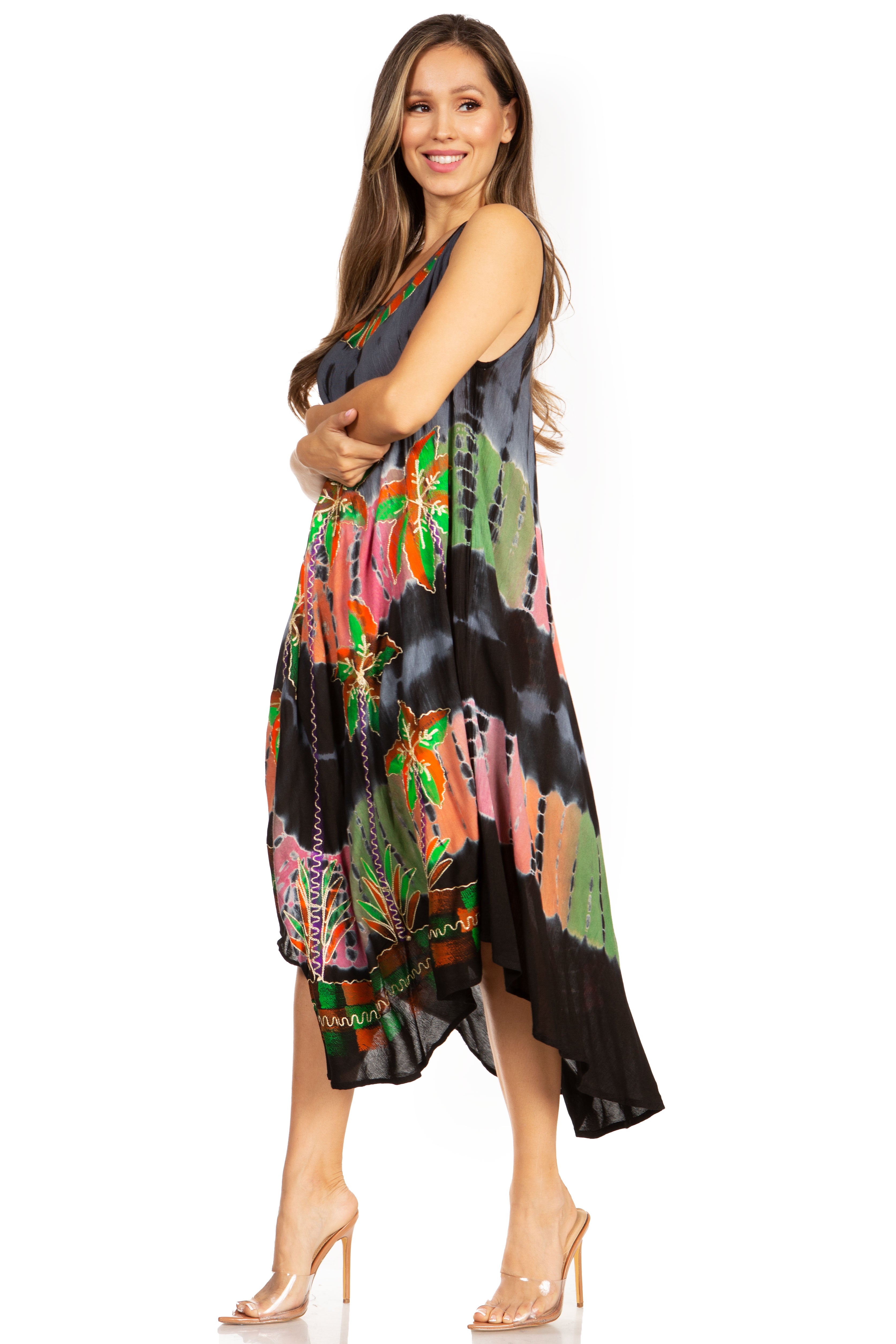 Woman wearing a colorful dress with a floral pattern on a white background