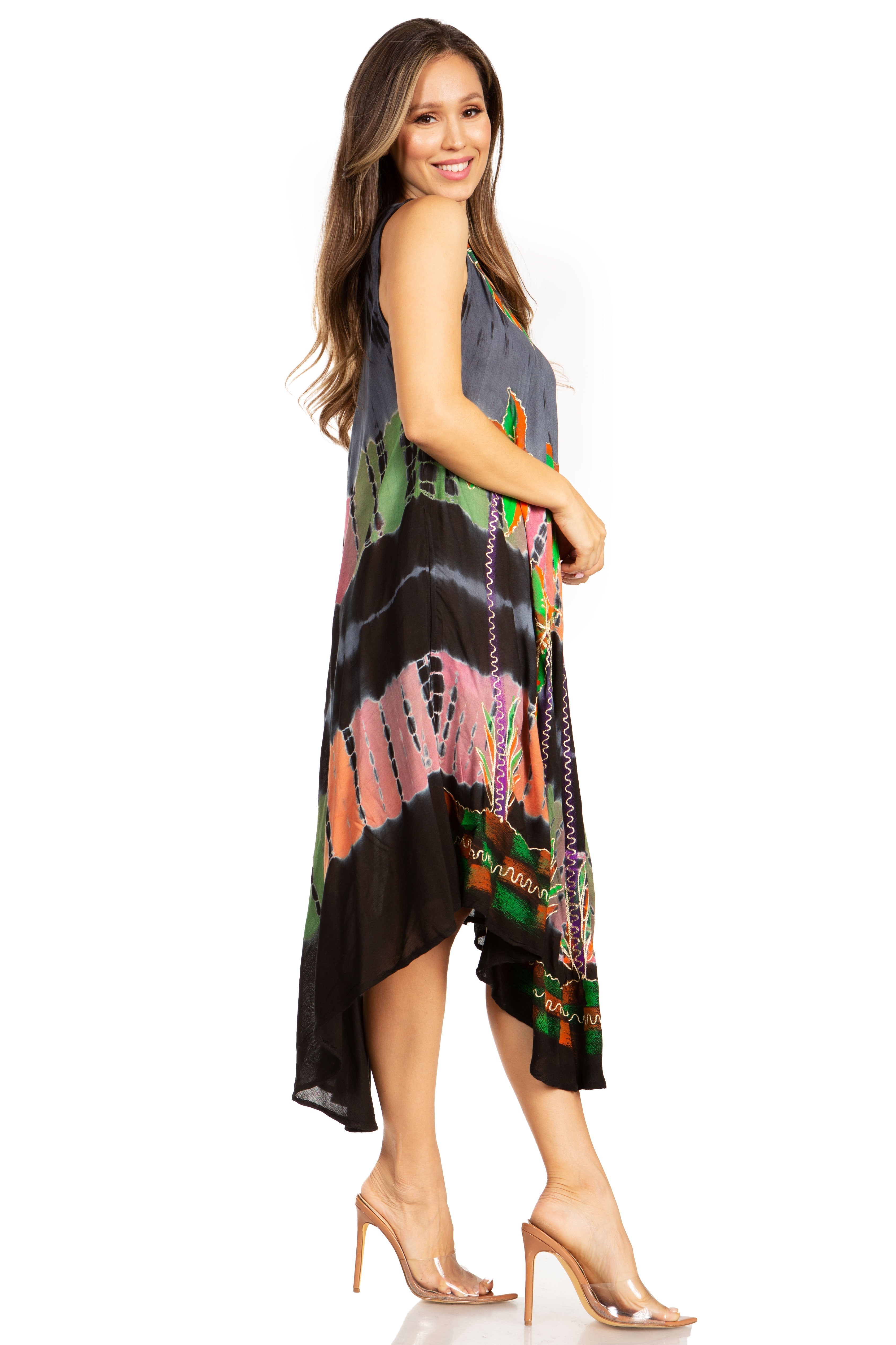 Woman wearing a colorful patterned dress on a white background