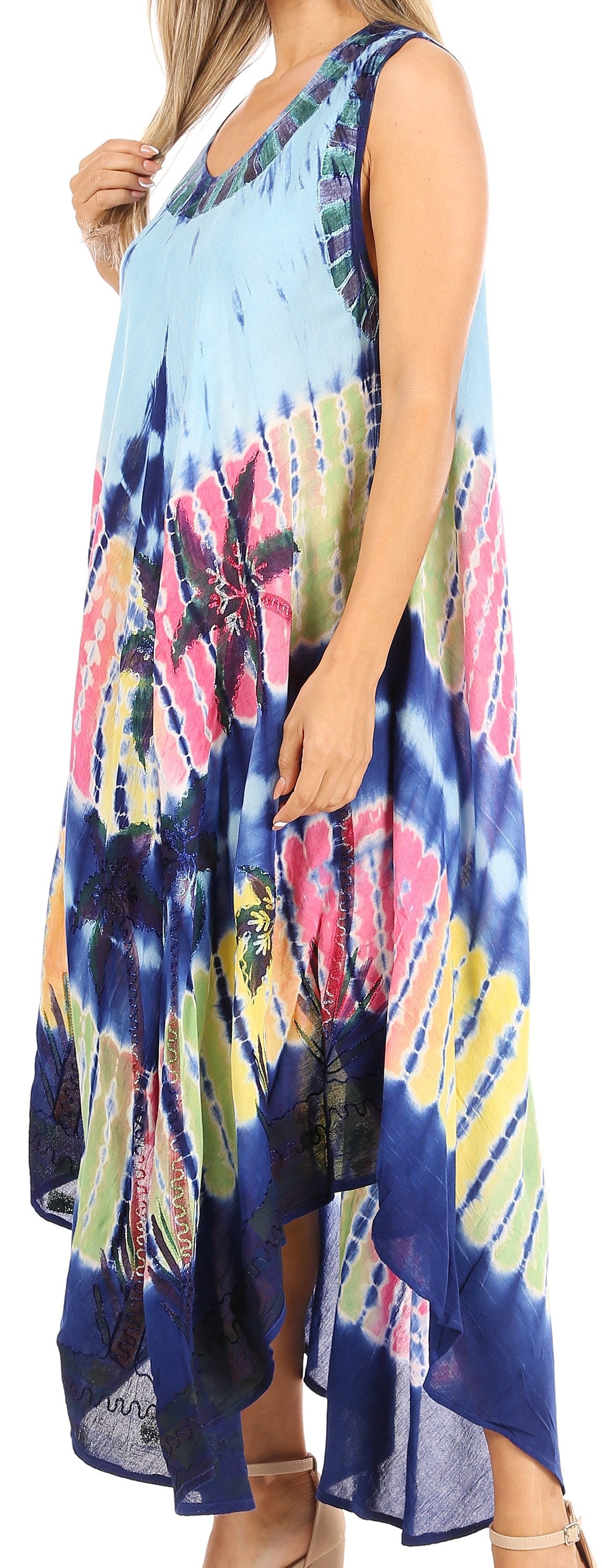 Woman wearing a colorful tie-dye dress with a blue background