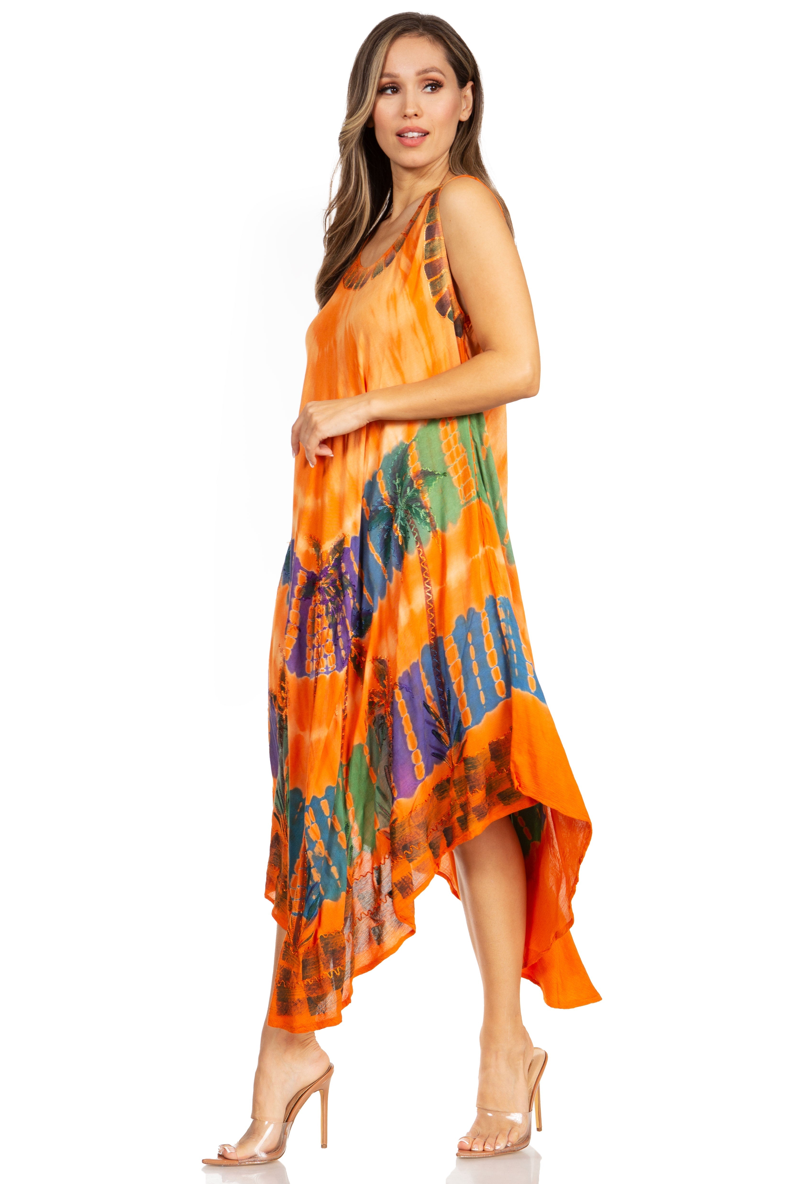 Woman wearing an orange patterned dress on a white background