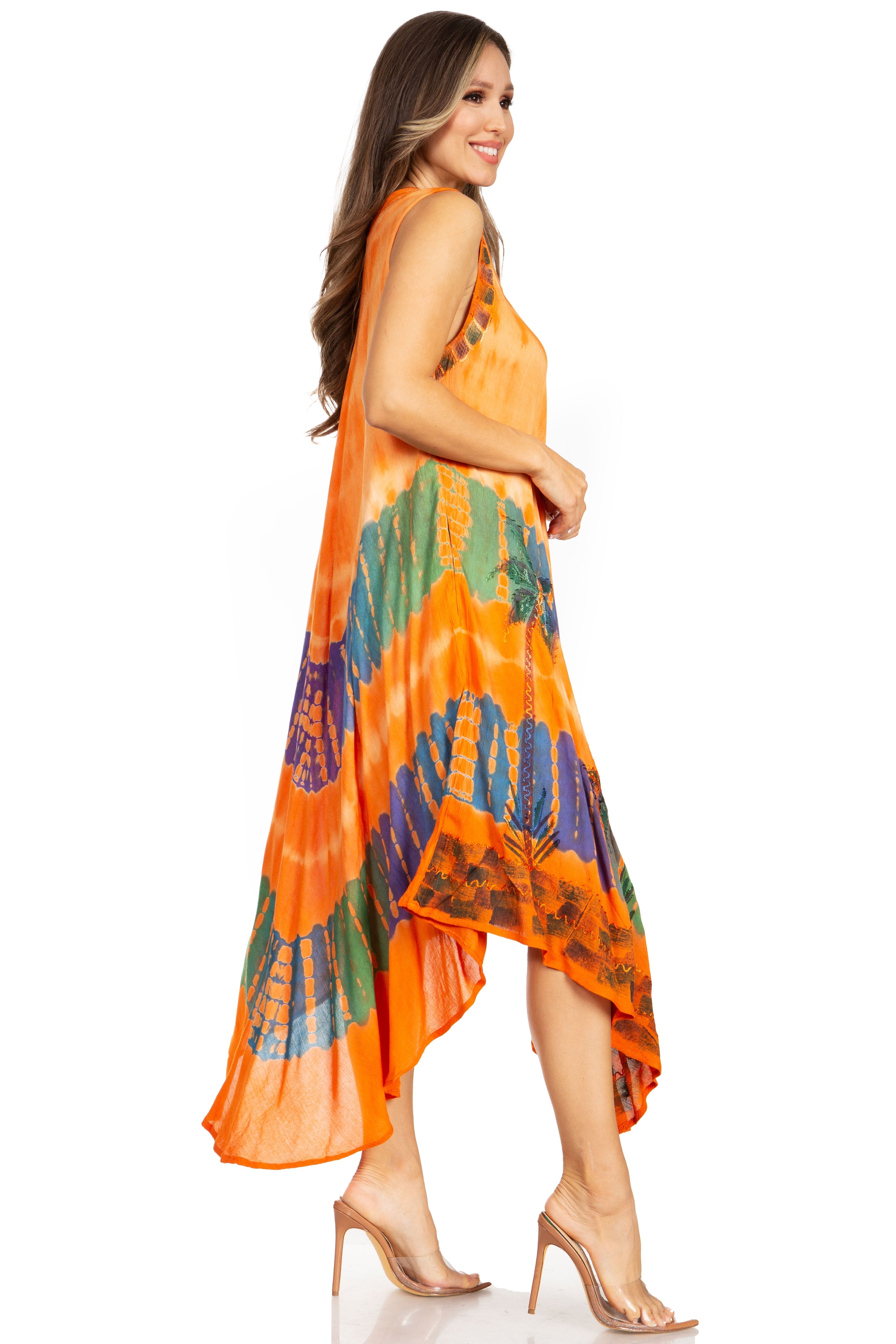Woman wearing an orange and multicolor patterned dress on a white background