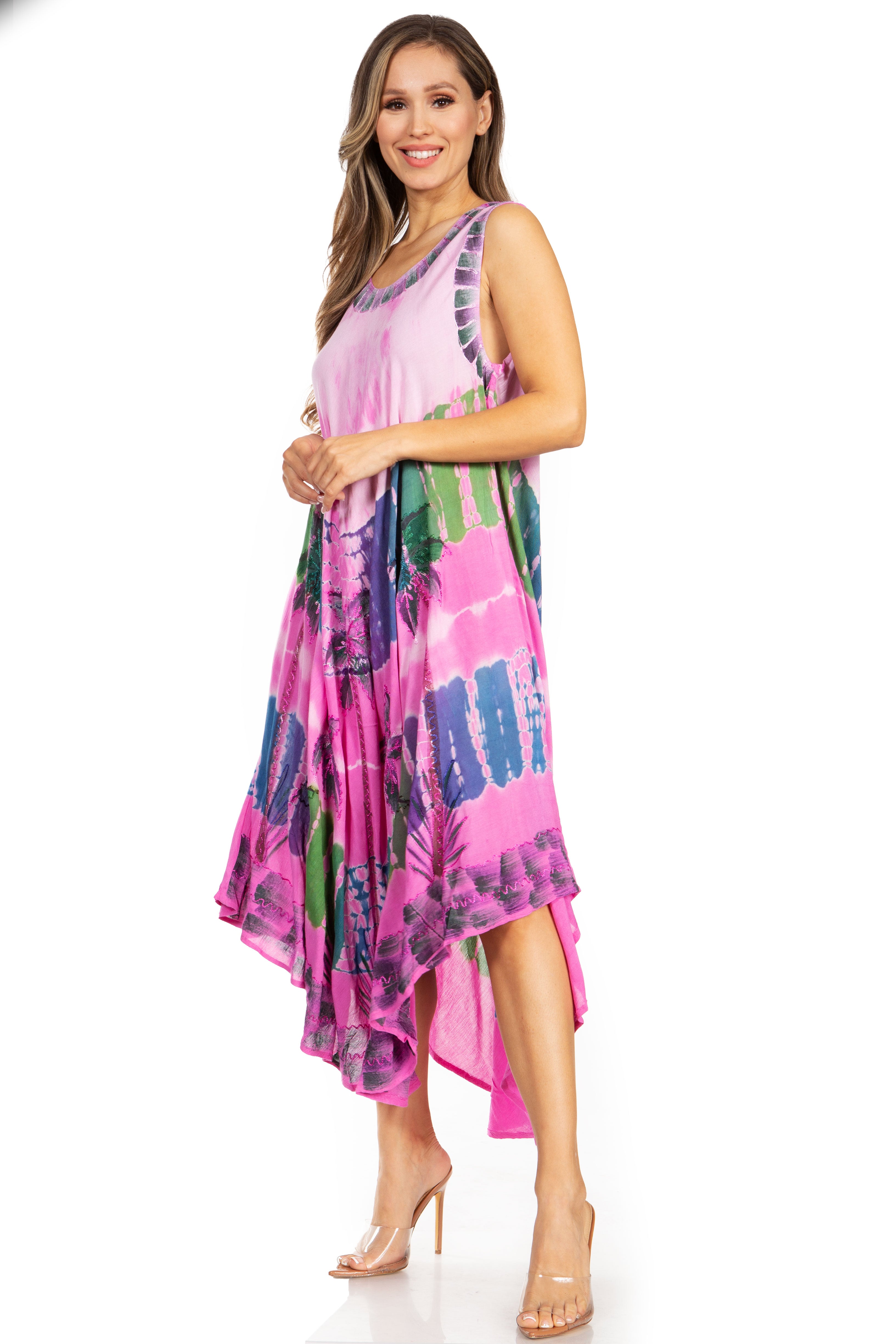 Woman wearing a pink and multicolor dress on a white background