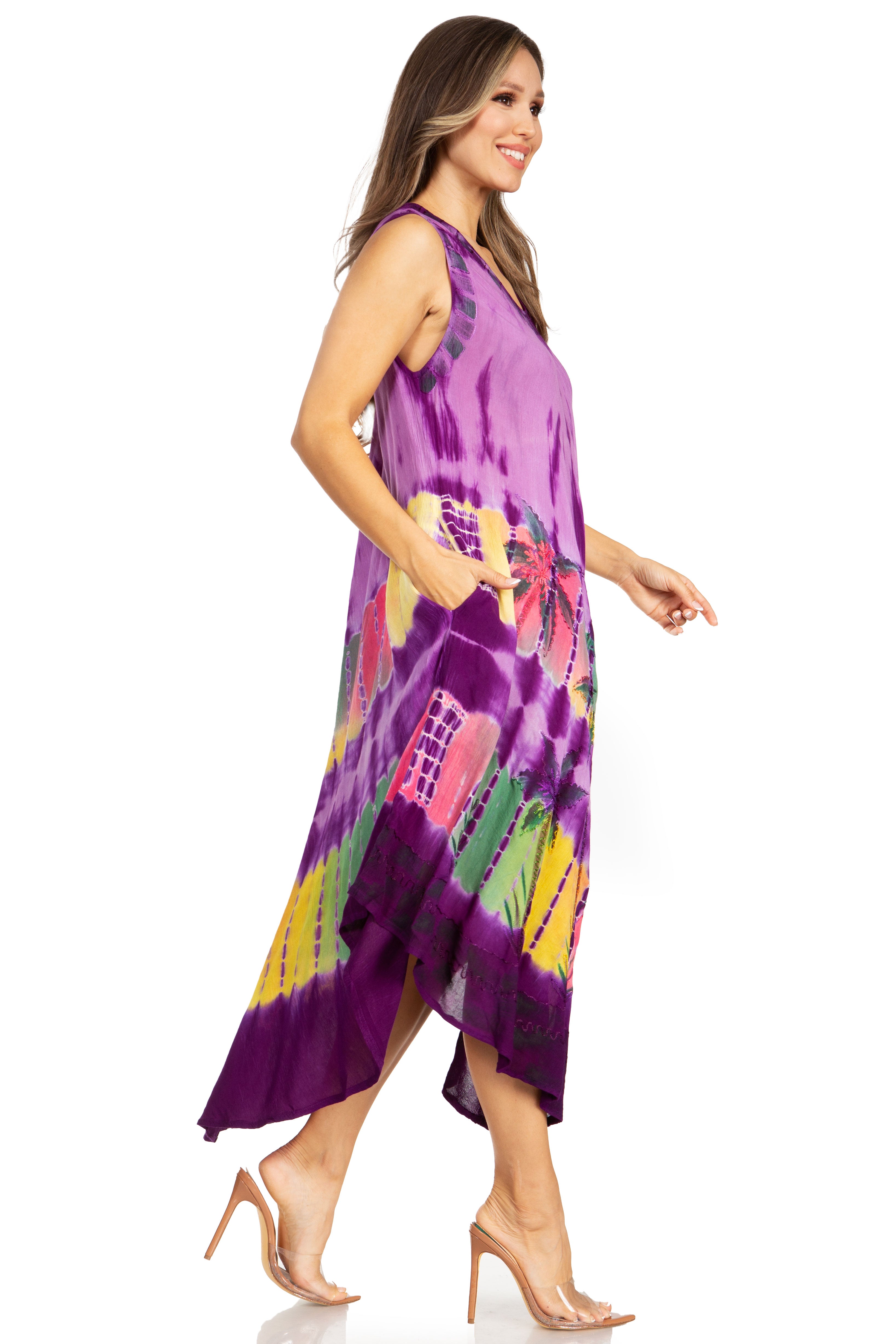 Woman wearing a purple tie-dye dress with colorful patterns on a white background