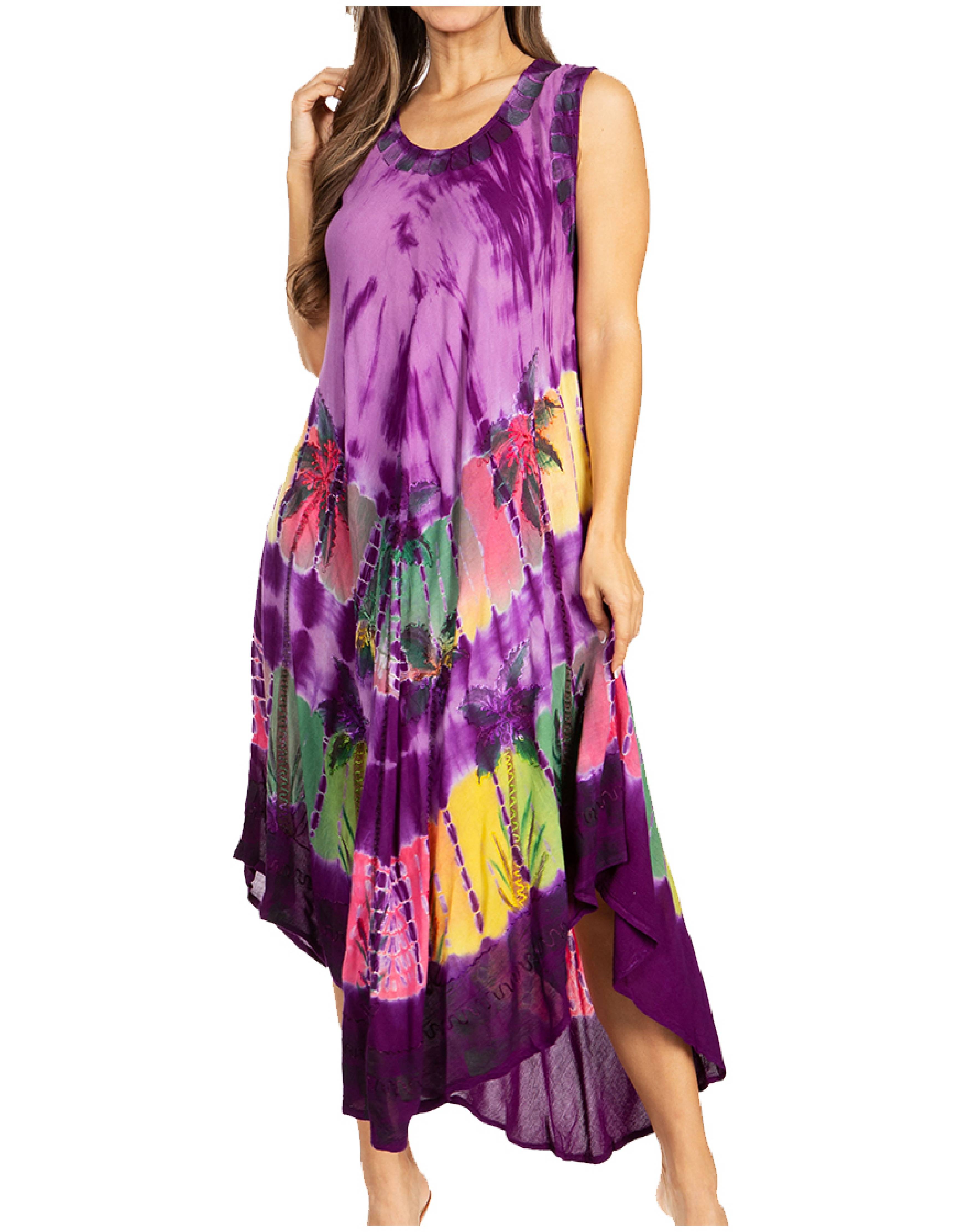 Woman wearing a tie-dye dress with a colorful pattern on a white background