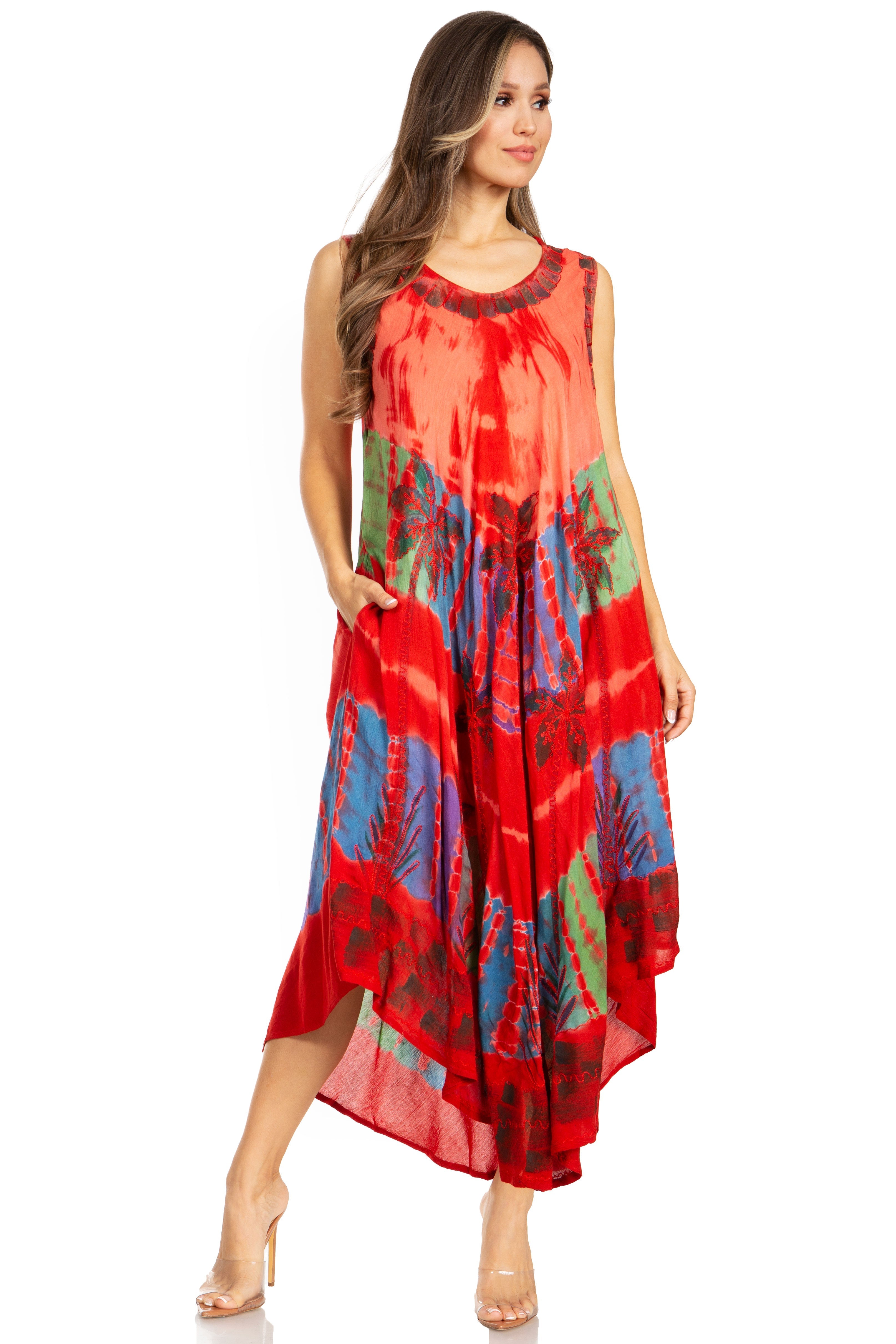 Woman wearing a red dress with colorful patterns on a white background