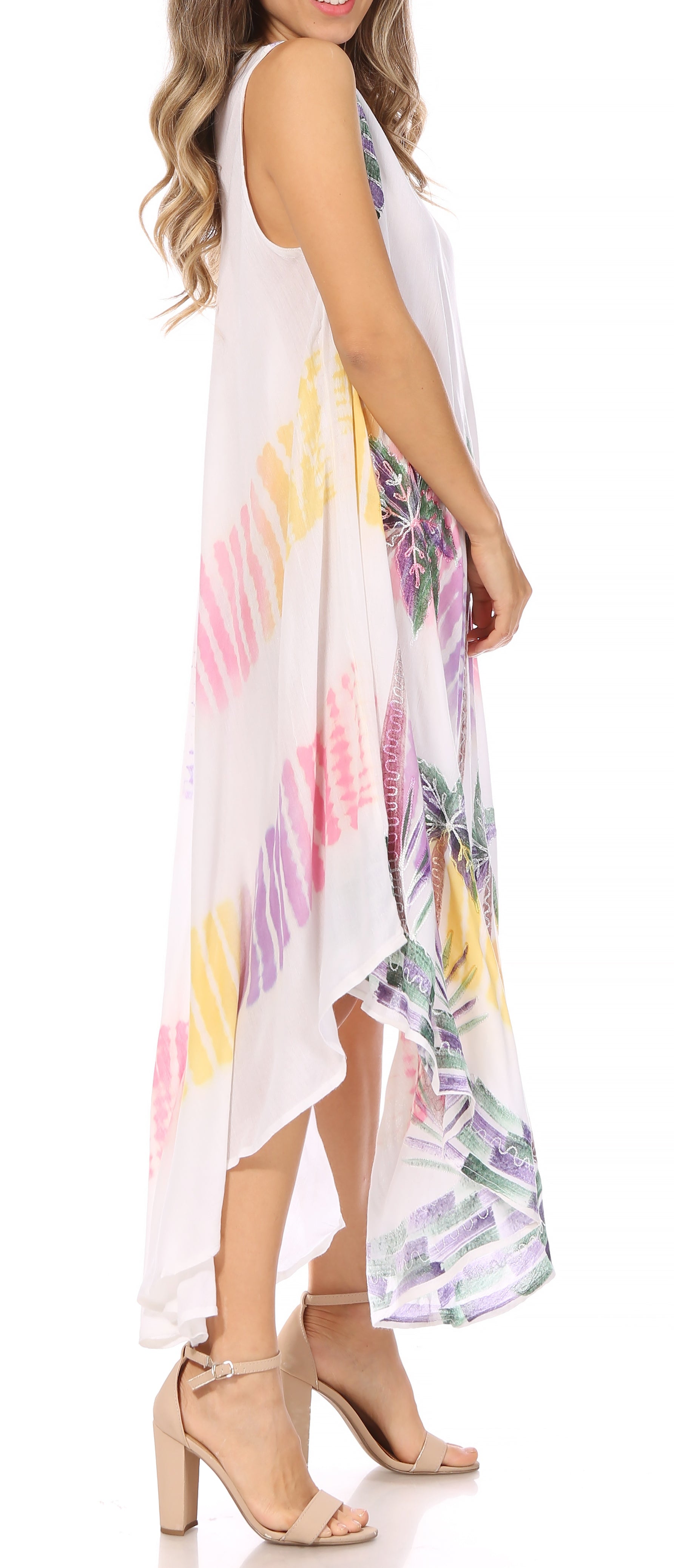 White sleeveless dress with colorful abstract patterns worn by a model on a white background