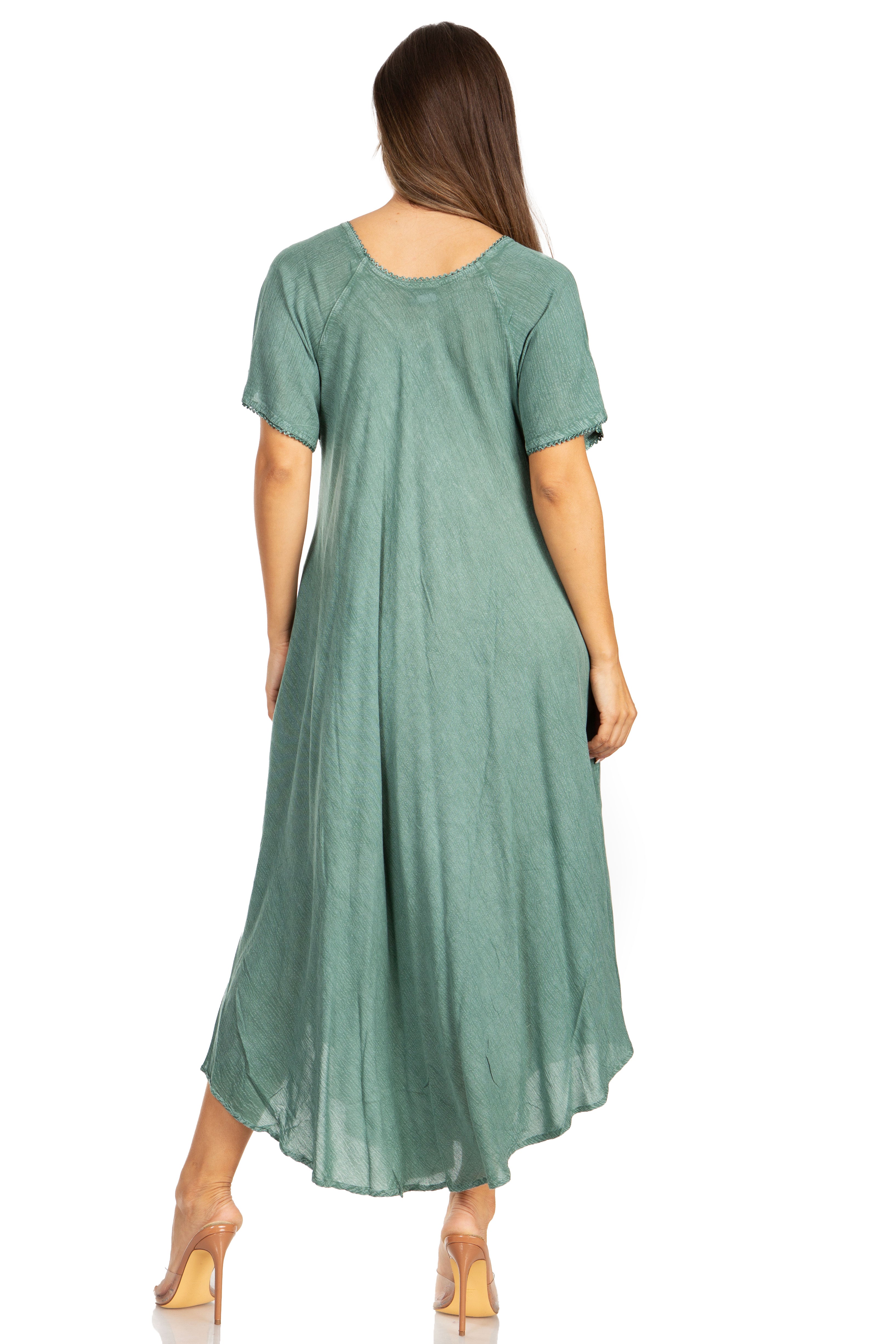 Woman wearing a green dress with a plain white background