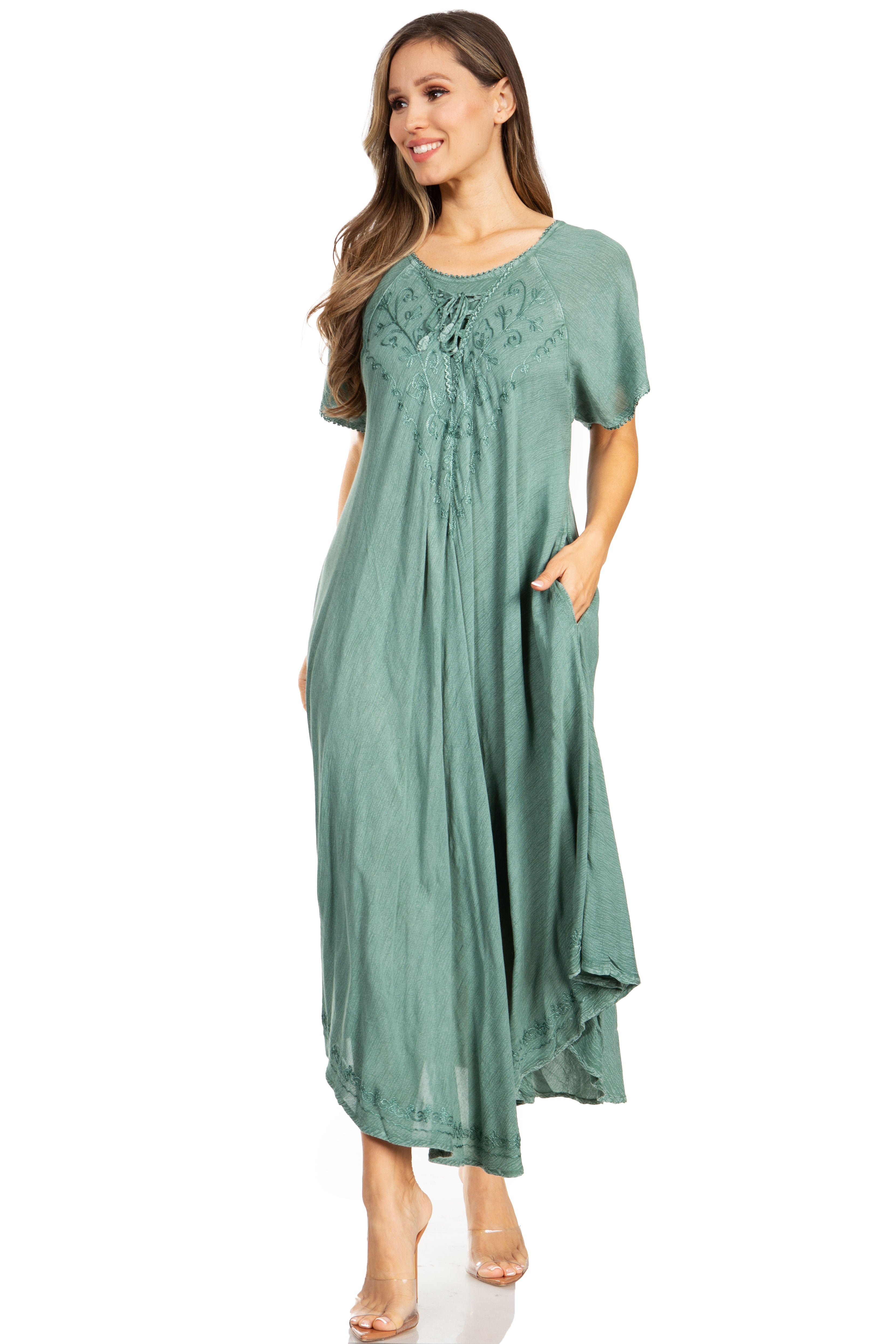 Woman wearing a green dress with lace details on a white background