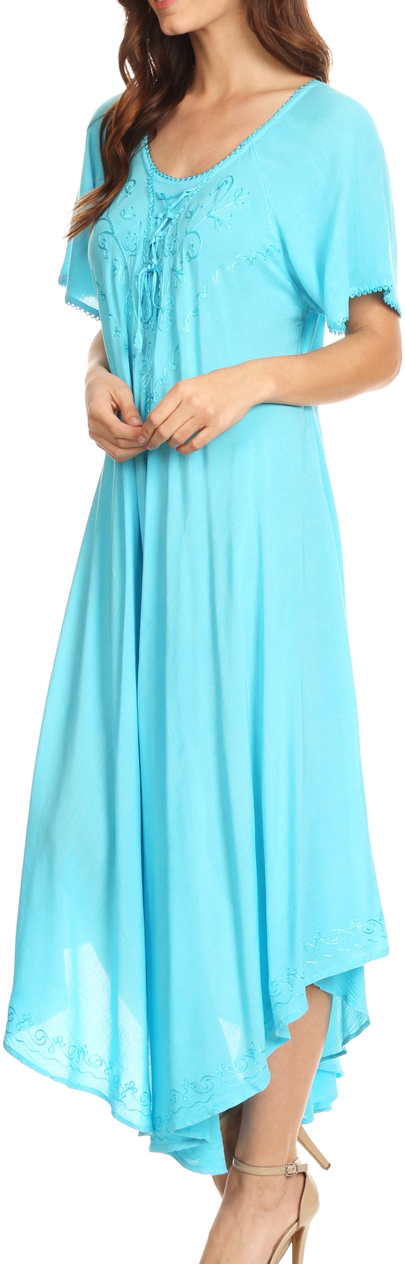 Woman wearing a light blue dress with a high-low hem design.