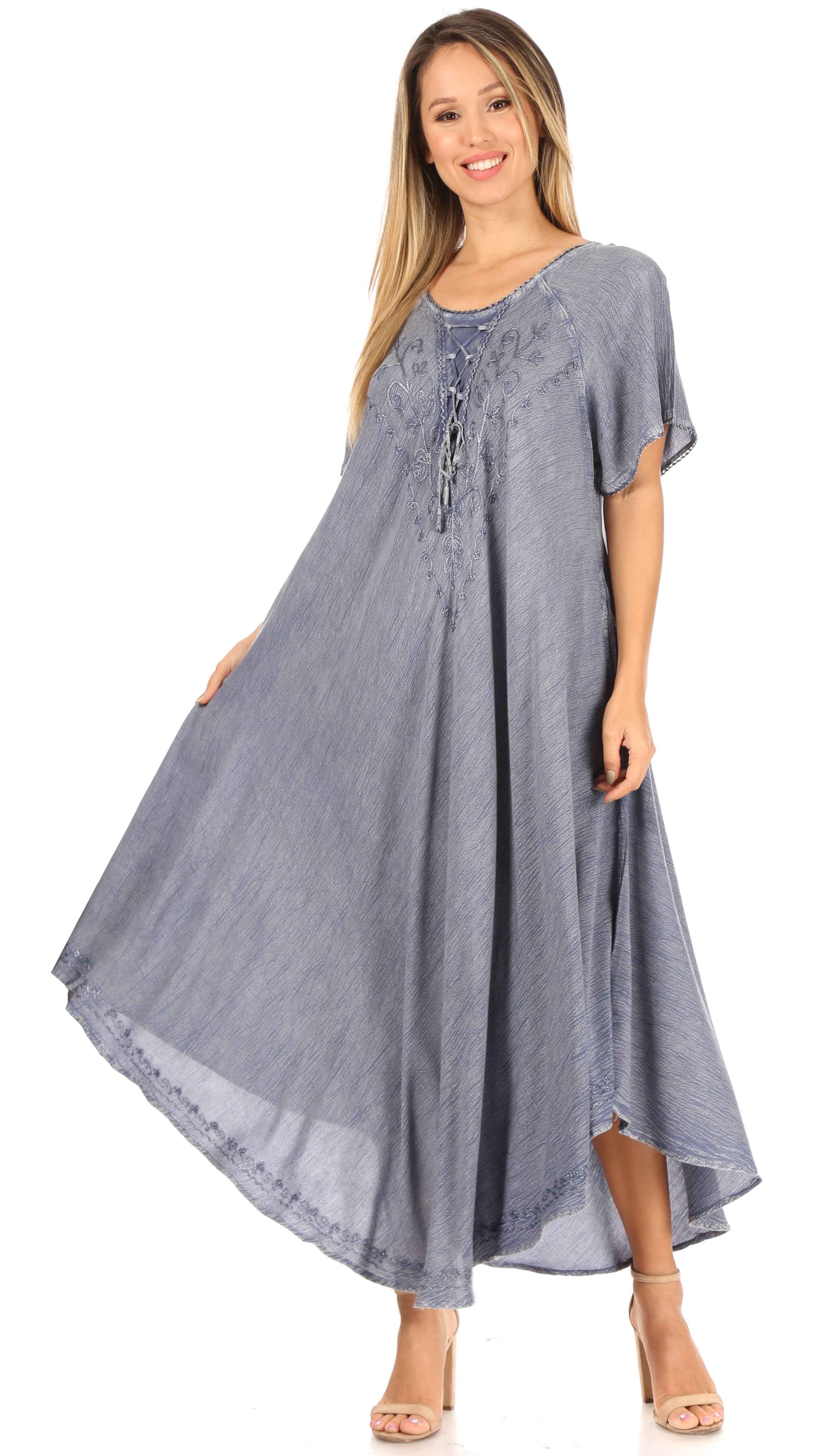 Woman wearing a long blue dress on a white background