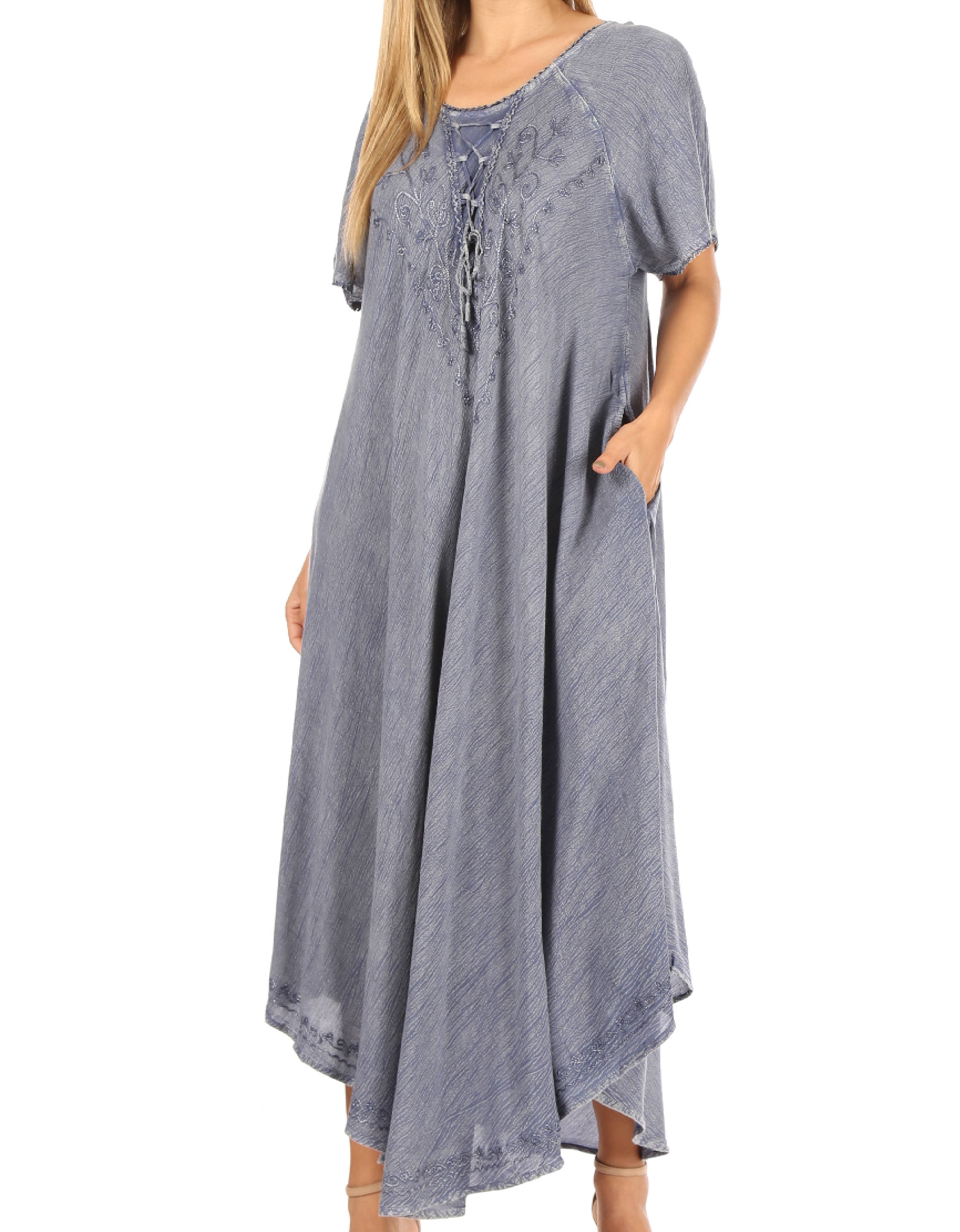 Woman wearing a long blue dress with short sleeves on a white background