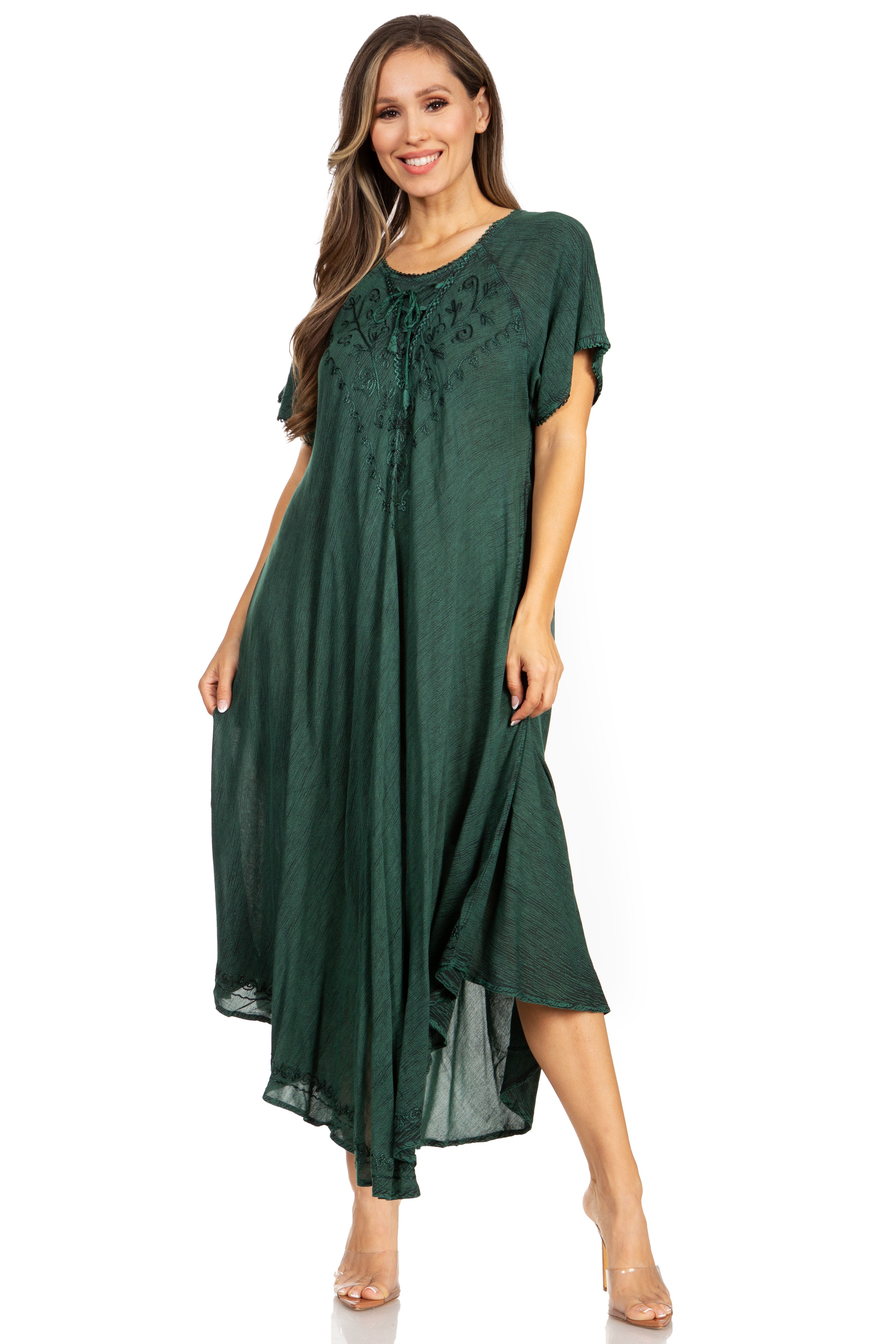 Woman wearing a green dress with lace details on a white background