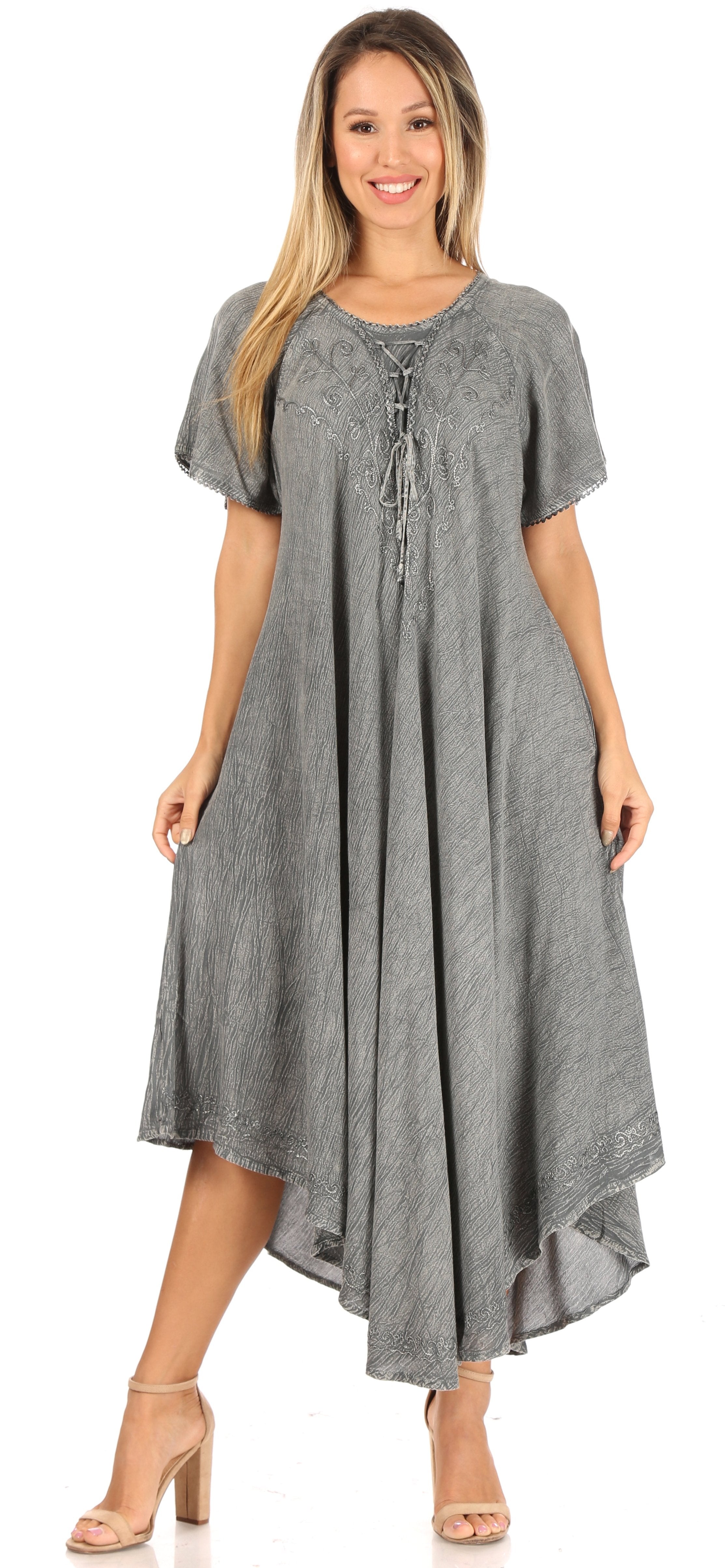 Woman wearing a gray dress with a white background
