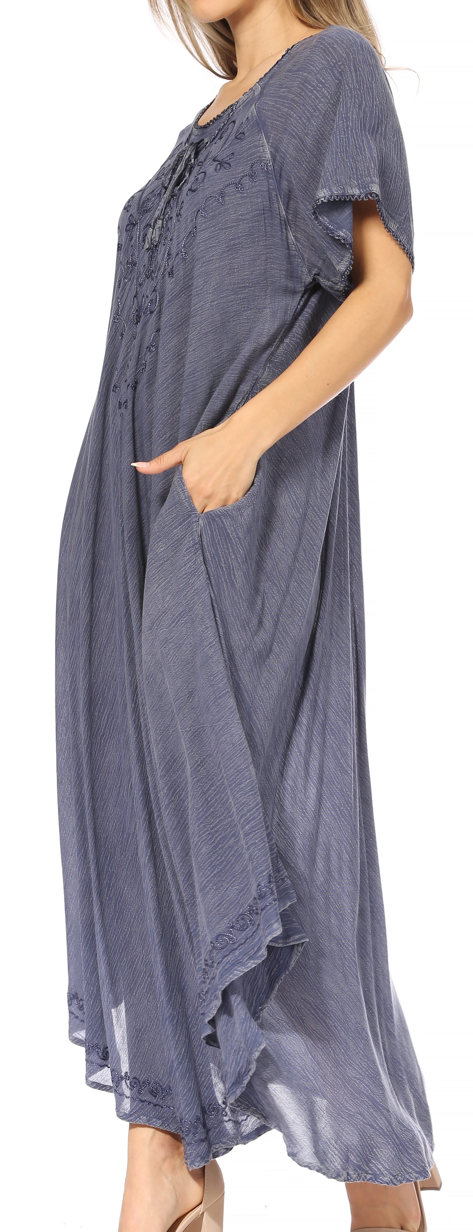 Long, flowing blue dress with short sleeves on a white background