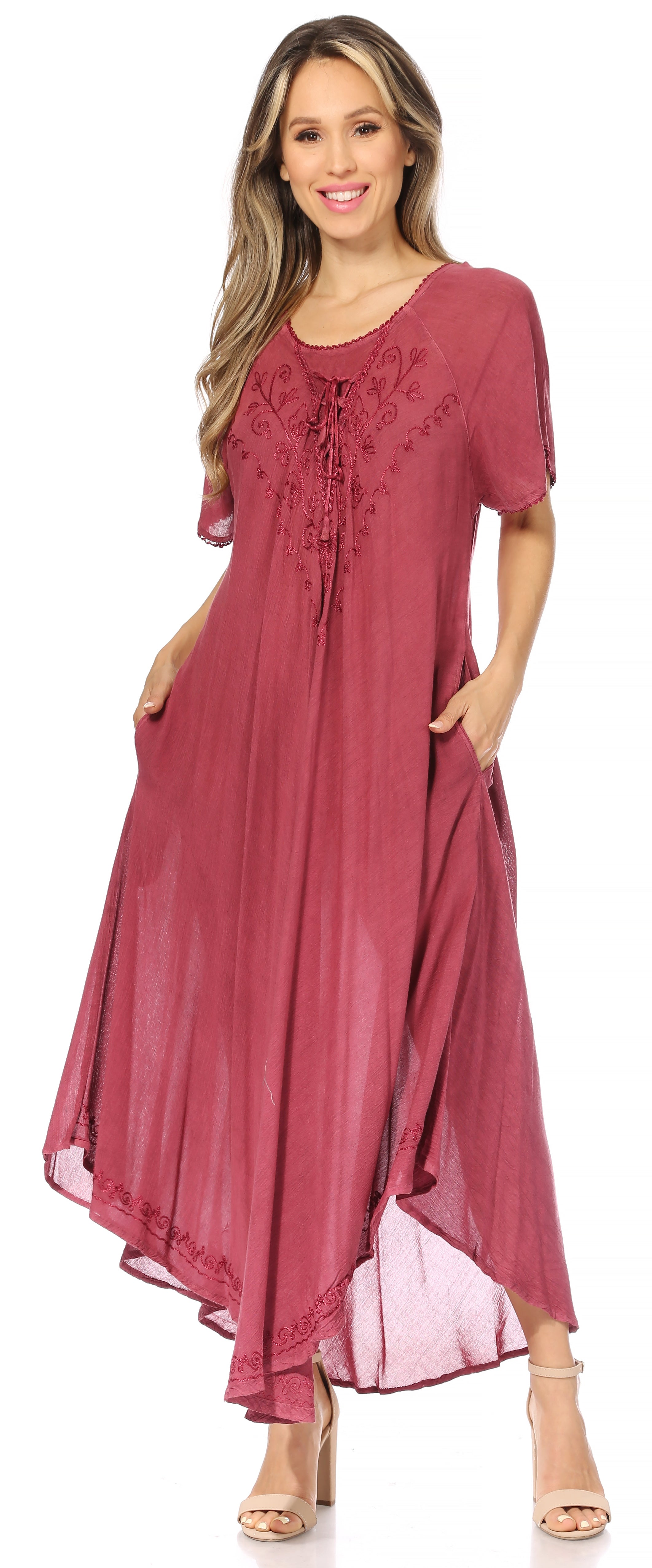 Woman wearing a long burgundy dress on a white background