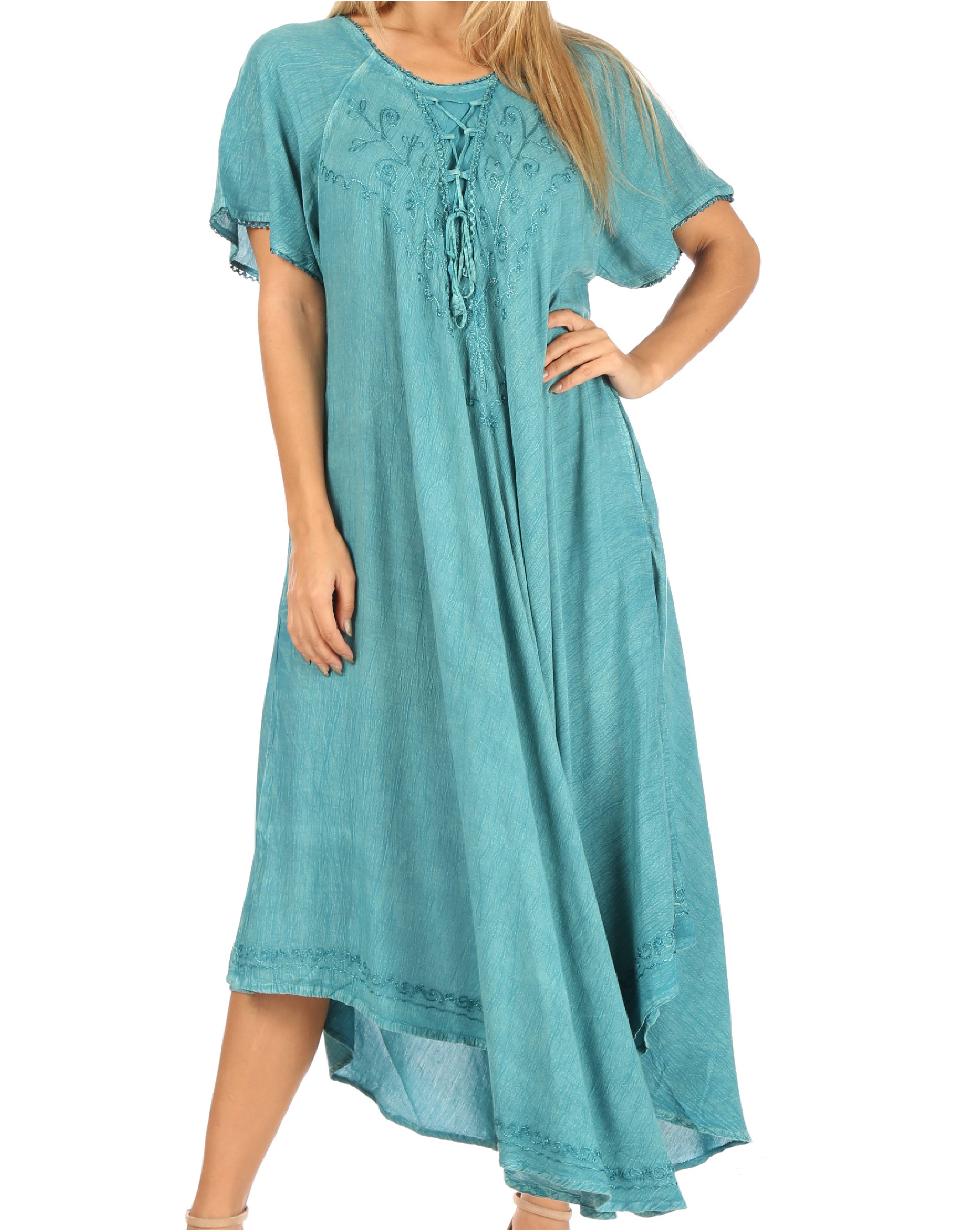 Woman wearing a teal dress on a white background