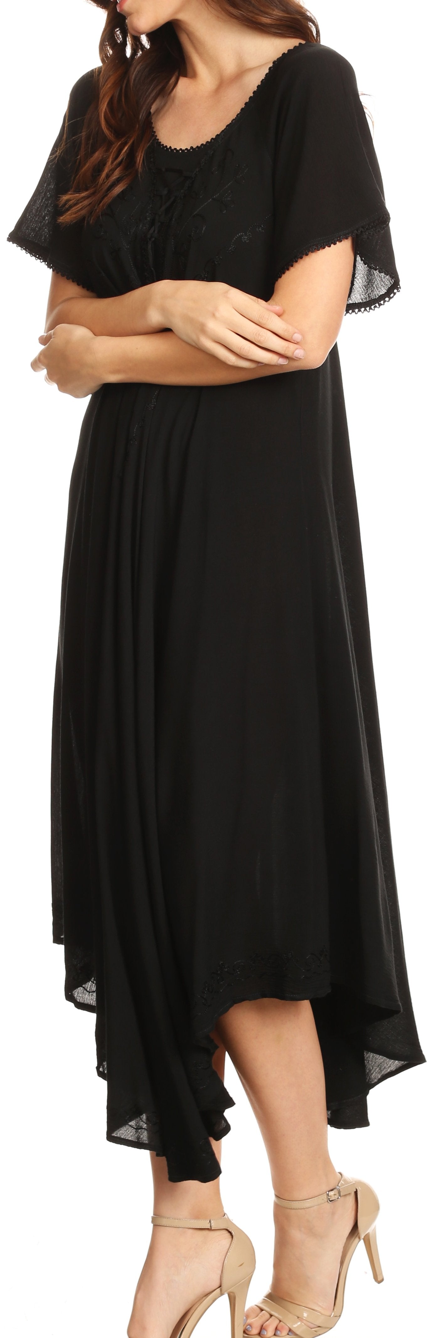 Woman wearing a black dress with a flowing skirt