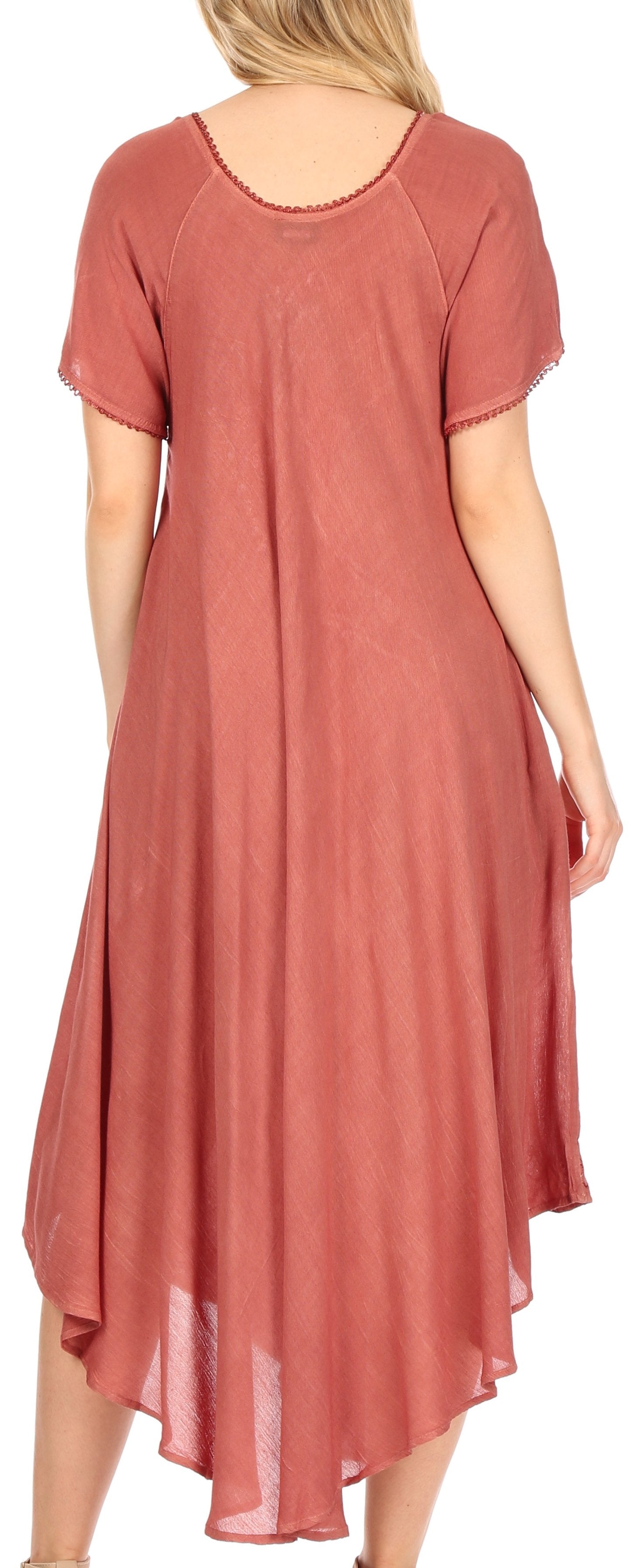 Woman wearing a long, flowing rust-colored dress with a soft texture.