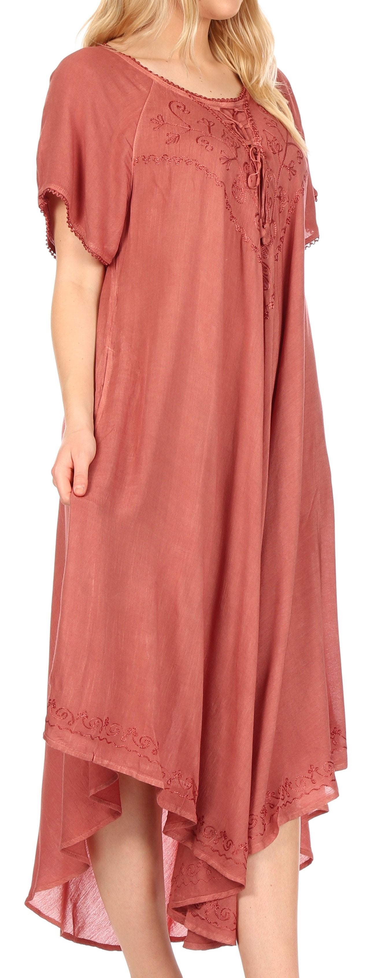 Pink dress with lace details on a white background