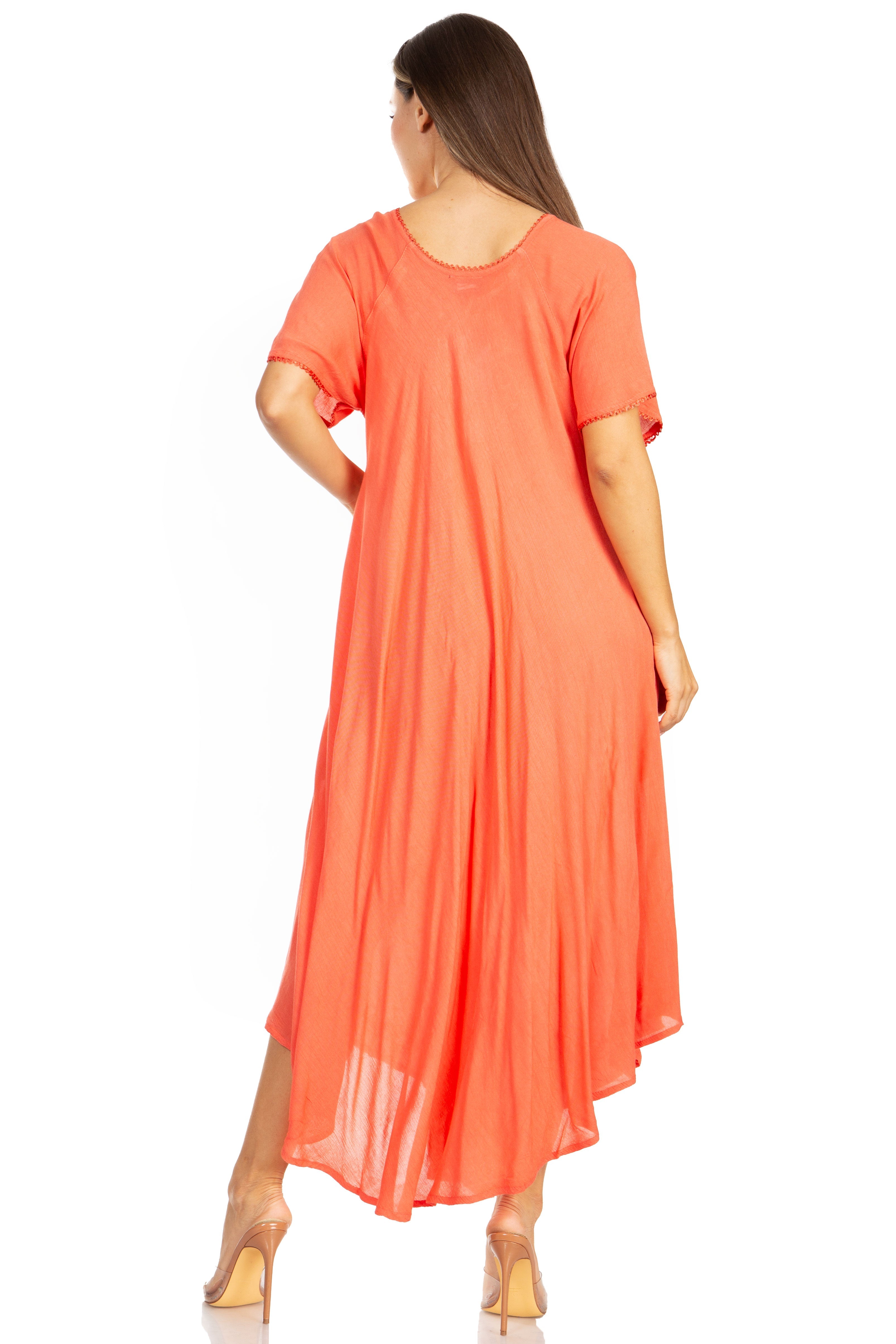 Woman wearing a coral dress on a white background