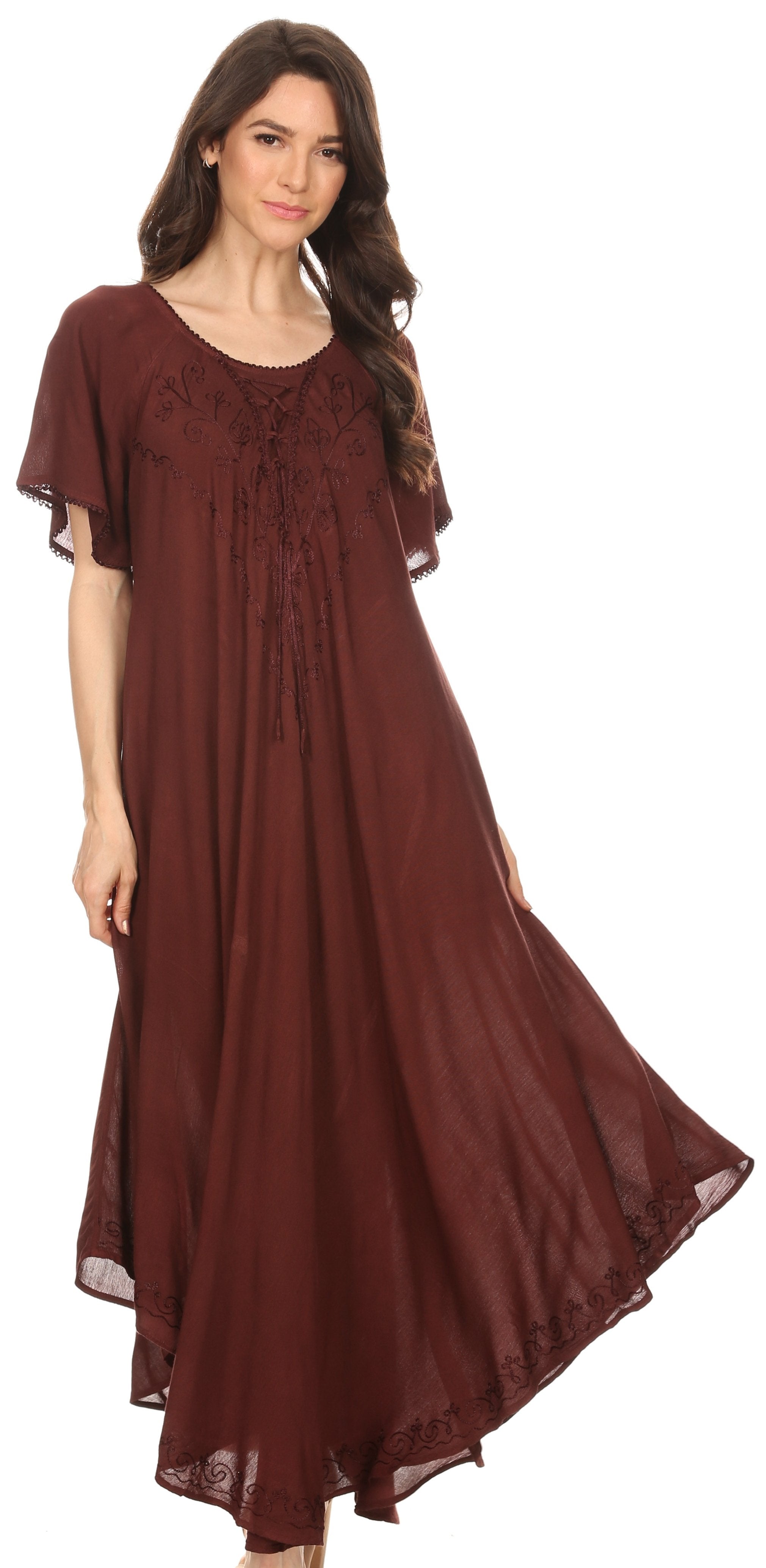 Woman wearing a long brown dress on a white background