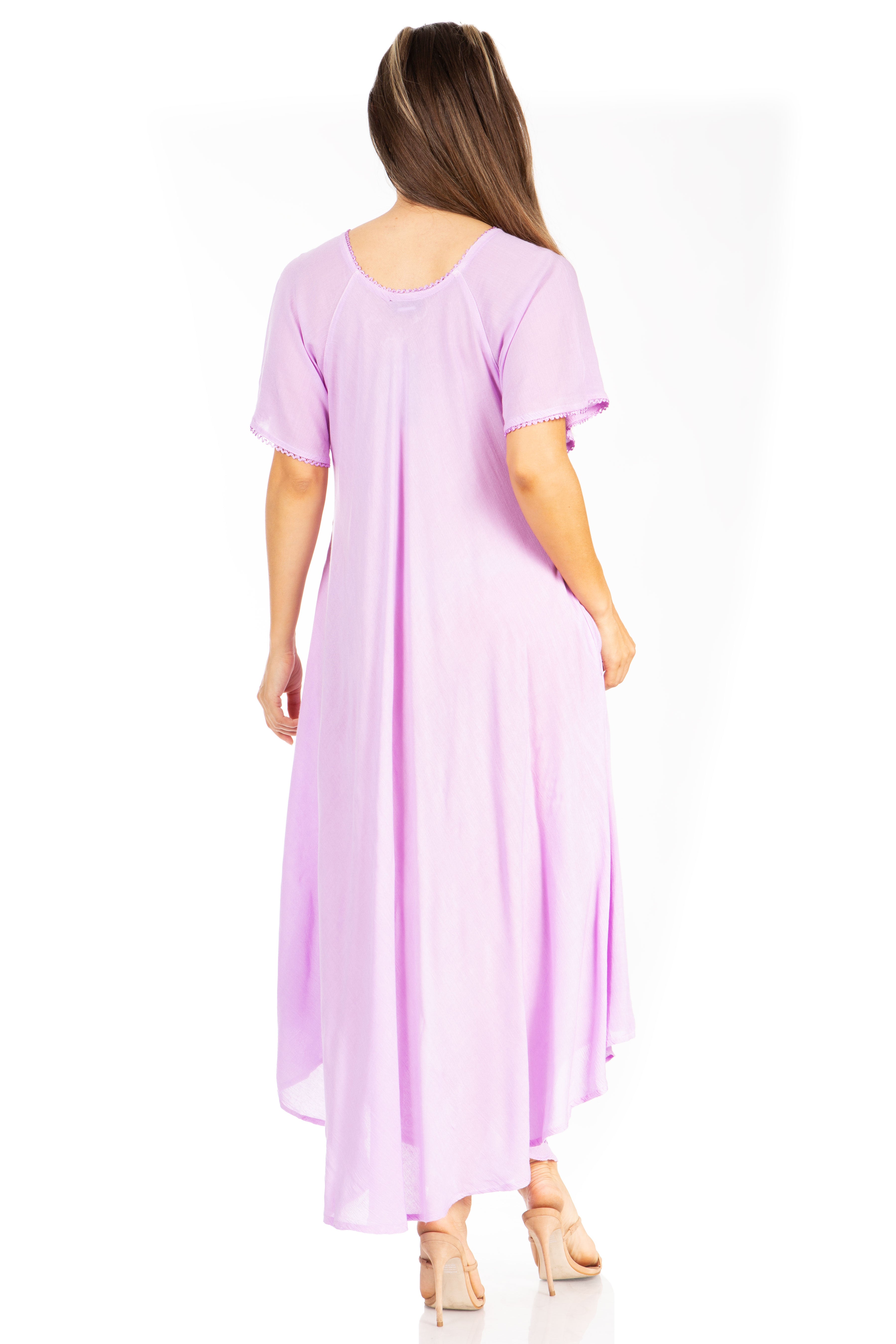 Woman wearing a long lilac dress on a white background
