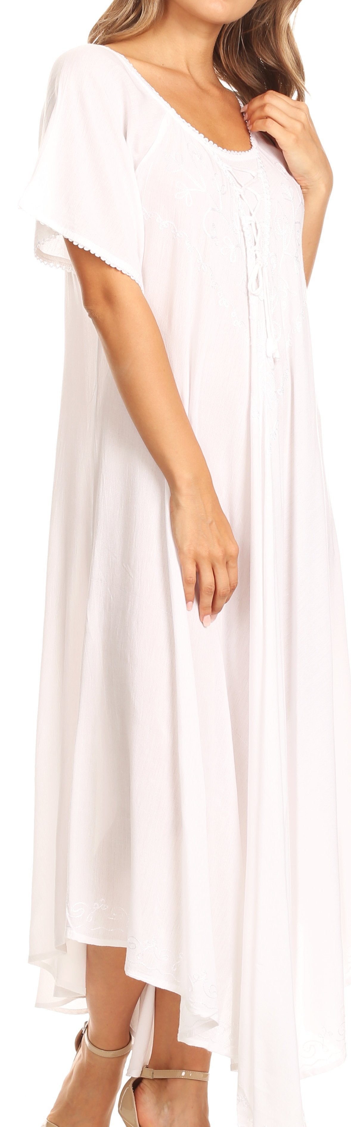 White dress worn by a model with a plain background