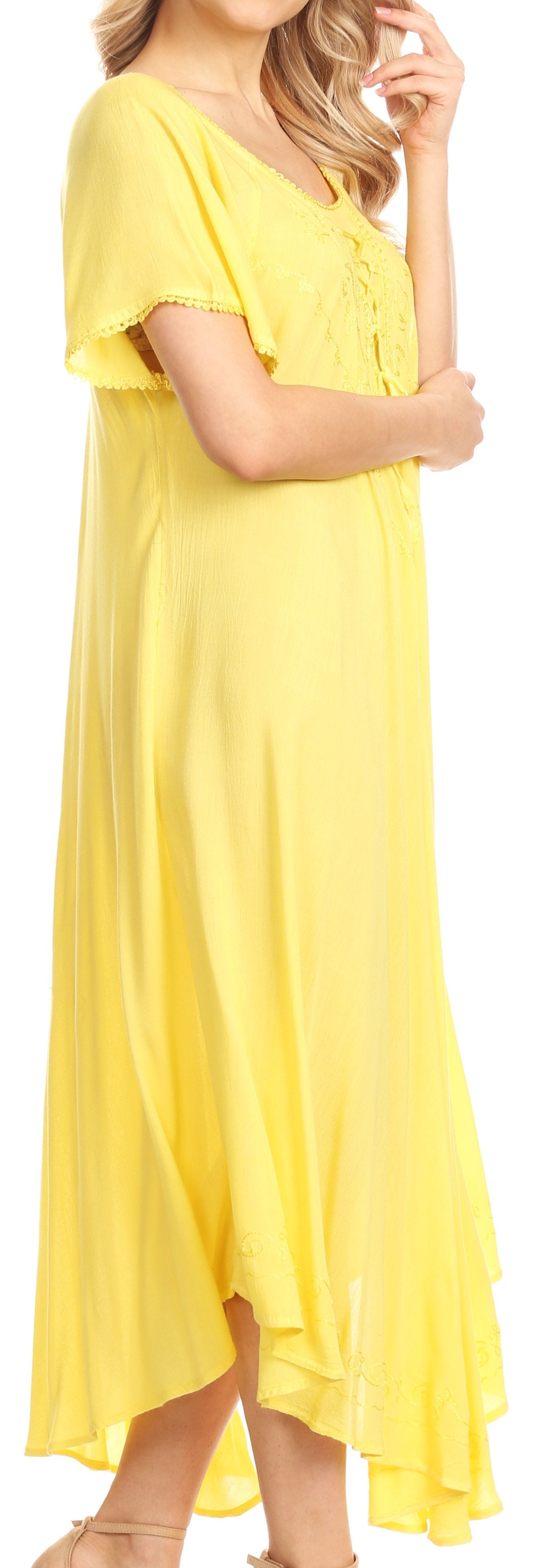 Woman wearing a yellow dress with short sleeves and a V-neckline.