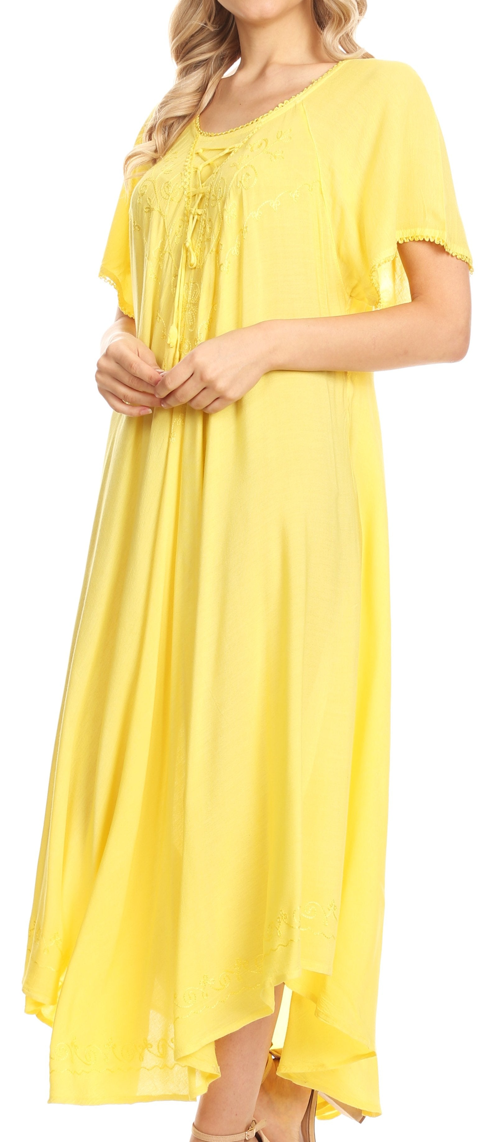 Woman wearing a yellow dress with short sleeves on a white background