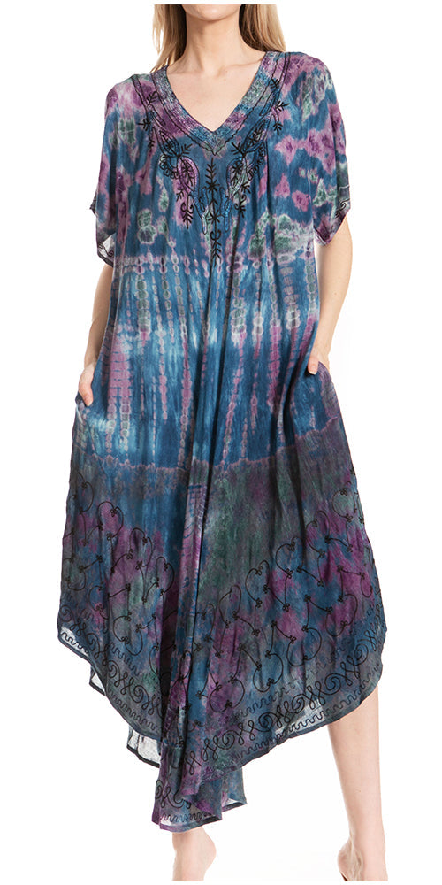 Woman wearing a colorful dress with a pattern on a white background