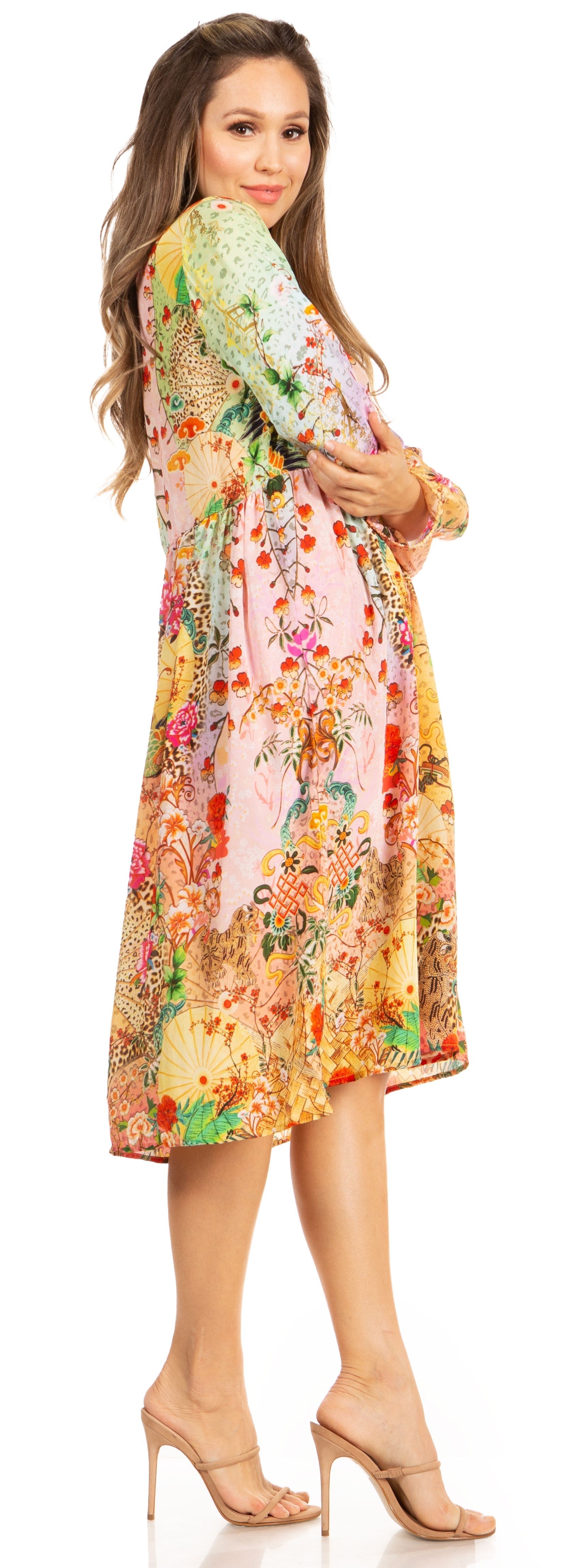 Woman wearing a colorful floral dress on a white background